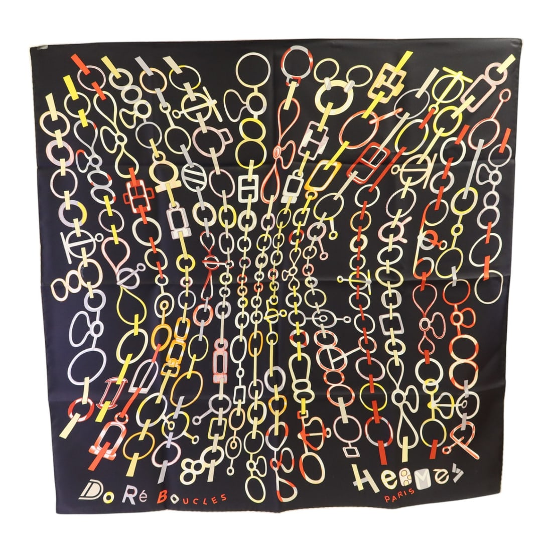 Silk Do Re Boucles 90x90 Scarf by Hermes in Black and Red: Silk Do Re Boucles 90x90 Scarf by Hermes in Black and Red Hermes Do Re Boucles scarf crafted from luxurious silk, featuring a striking black base with red and multicolor accents. This elegant accessor
