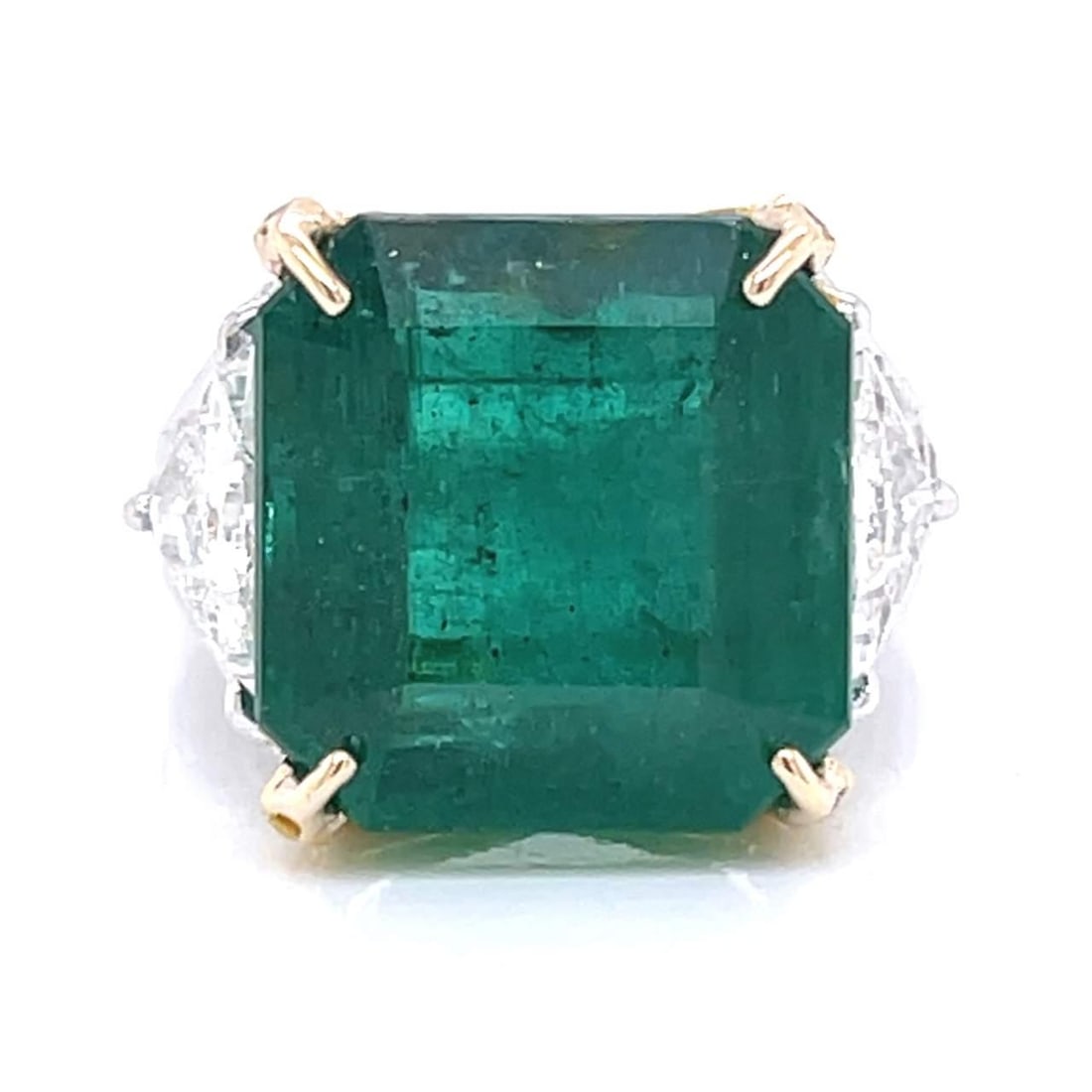 GIA Certified 18K Gold 15.14 Ct Emerald Diamond Ring: GIA Certified 18K Gold 15.14 Ct Emerald Diamond Ring This stunning 18K Yellow and White Gold ring features a GIA Certified 15.14 Ct. Emerald at its center, surrounded by a dazzling array of diamonds. 