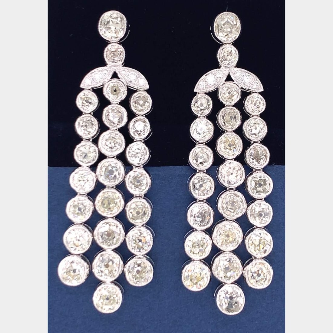 20.11 Ct Old Mine Diamond Chandelier Earrings in Platinum: 20.11 Ct Old Mine Diamond Chandelier Earrings in Platinum These exquisite chandelier earrings showcase a stunning total of 20.11 carats of Old Mine Diamonds, presenting a captivating play of light and