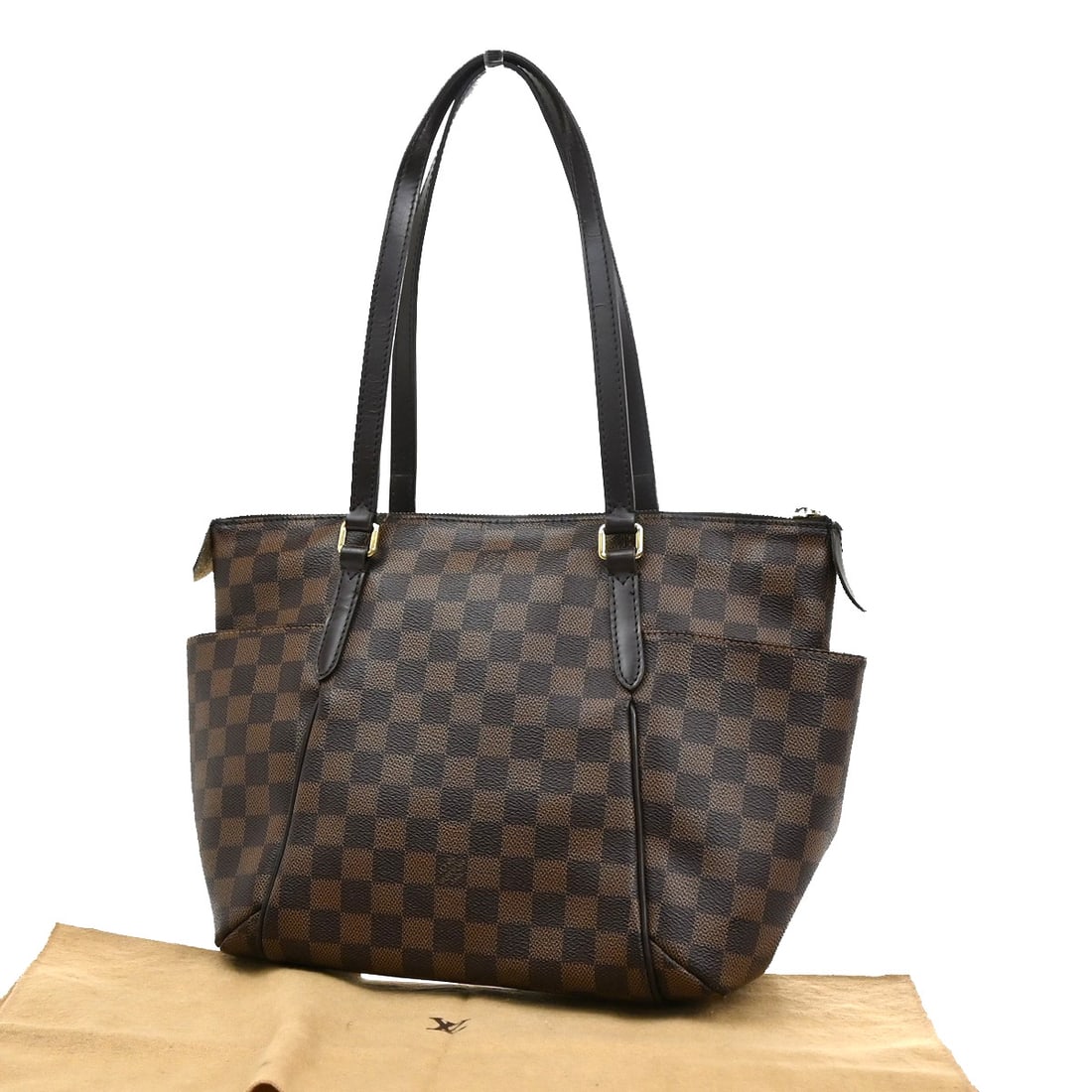 Louis Vuitton Damier Canvas Totally Shoulder Bag Brown 28x24x13cm: Louis Vuitton Damier Canvas Totally Shoulder Bag Brown 28x24x13cm This Louis Vuitton Totally Handbag features a brown Damier canvas exterior designed for women. The handbag measures 28cm by 24cm by 13
