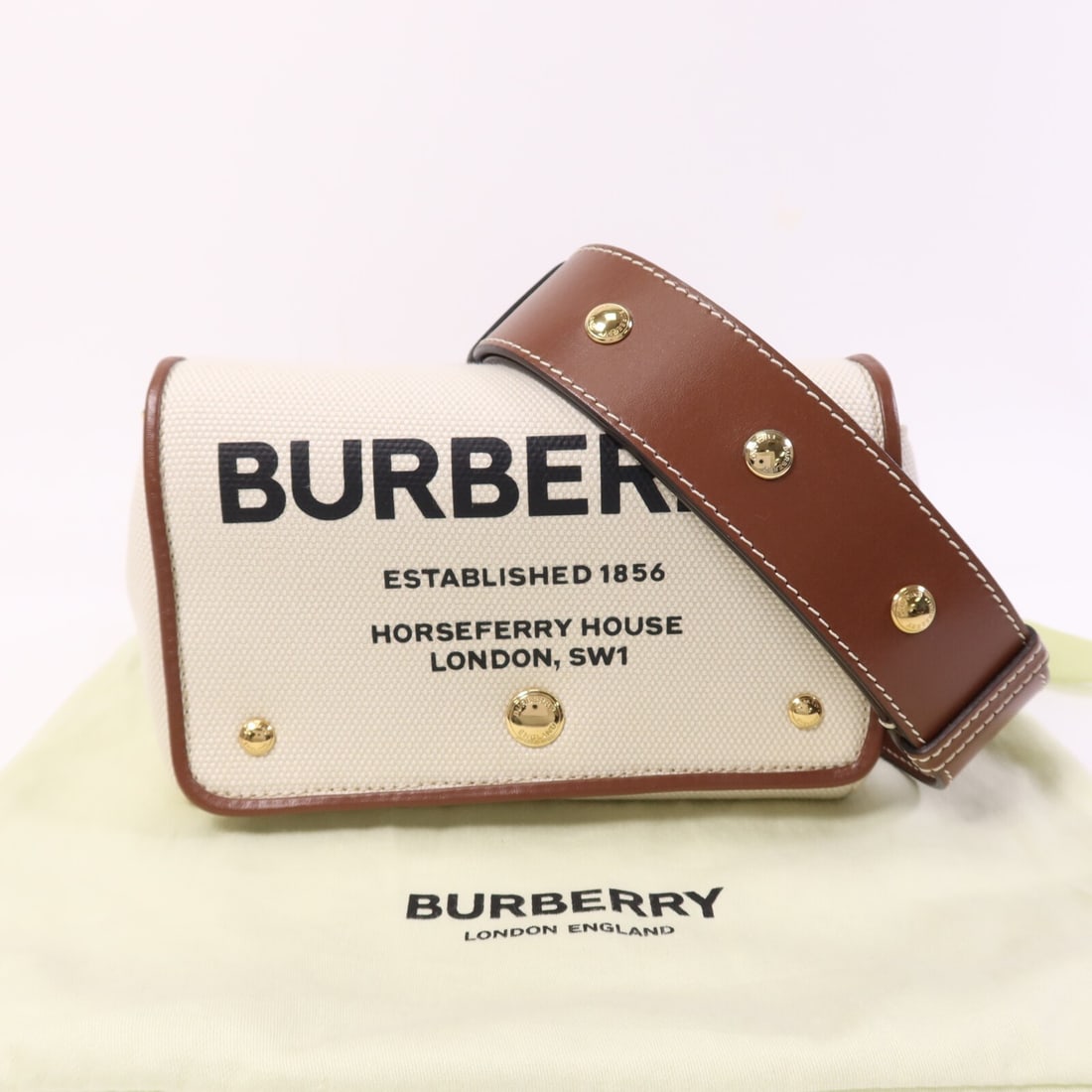 Burberry Horseferry Canvas Beige Shoulder Bag with Gold Tone Hardware: Burberry Horseferry Canvas Beige Shoulder Bag with Gold Tone Hardware This Burberry Horseferry shoulder bag features a beige canvas exterior and a compact design, offering both style and practicality.