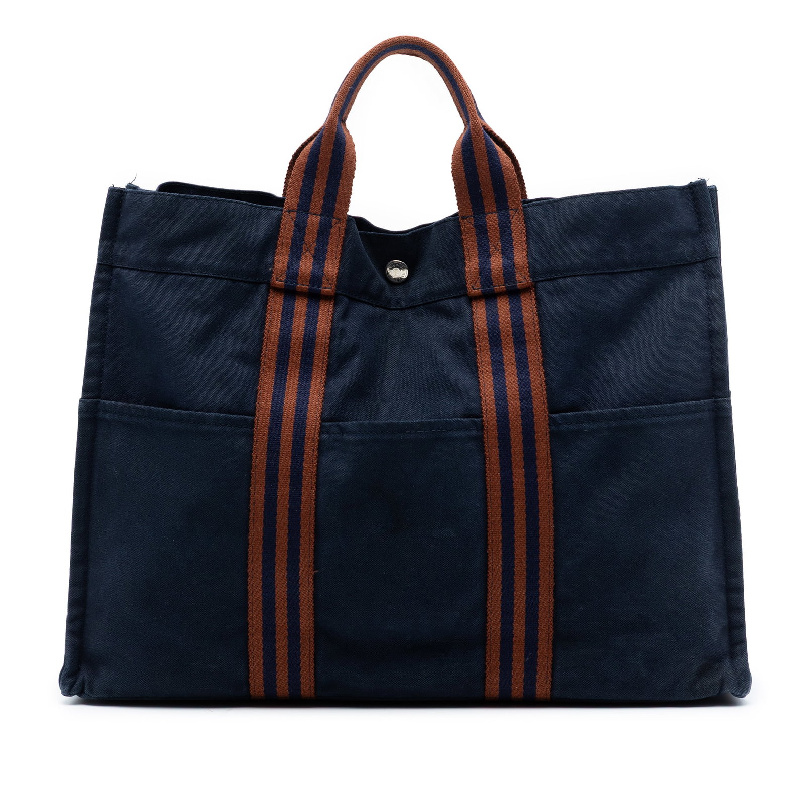 Hermes Fourre Tout MM Blue Canvas Tote with Slip Pockets: Hermes Fourre Tout MM Blue Canvas Tote with Slip Pockets The Hermes Fourre Tout MM tote is crafted from durable blue canvas and features front and back exterior slip pockets, flat handles, an open top