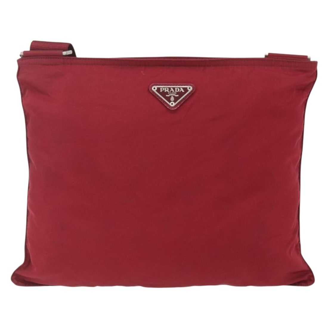 Red Nylon Prada Messenger with Zip Closure Unisex Bag: Red Nylon Prada Messenger with Zip Closure Unisex Bag This Prada Zip Top Messenger Bag is crafted from durable red nylon and designed for unisex use. It features a zip-top closure and an adjustable sh