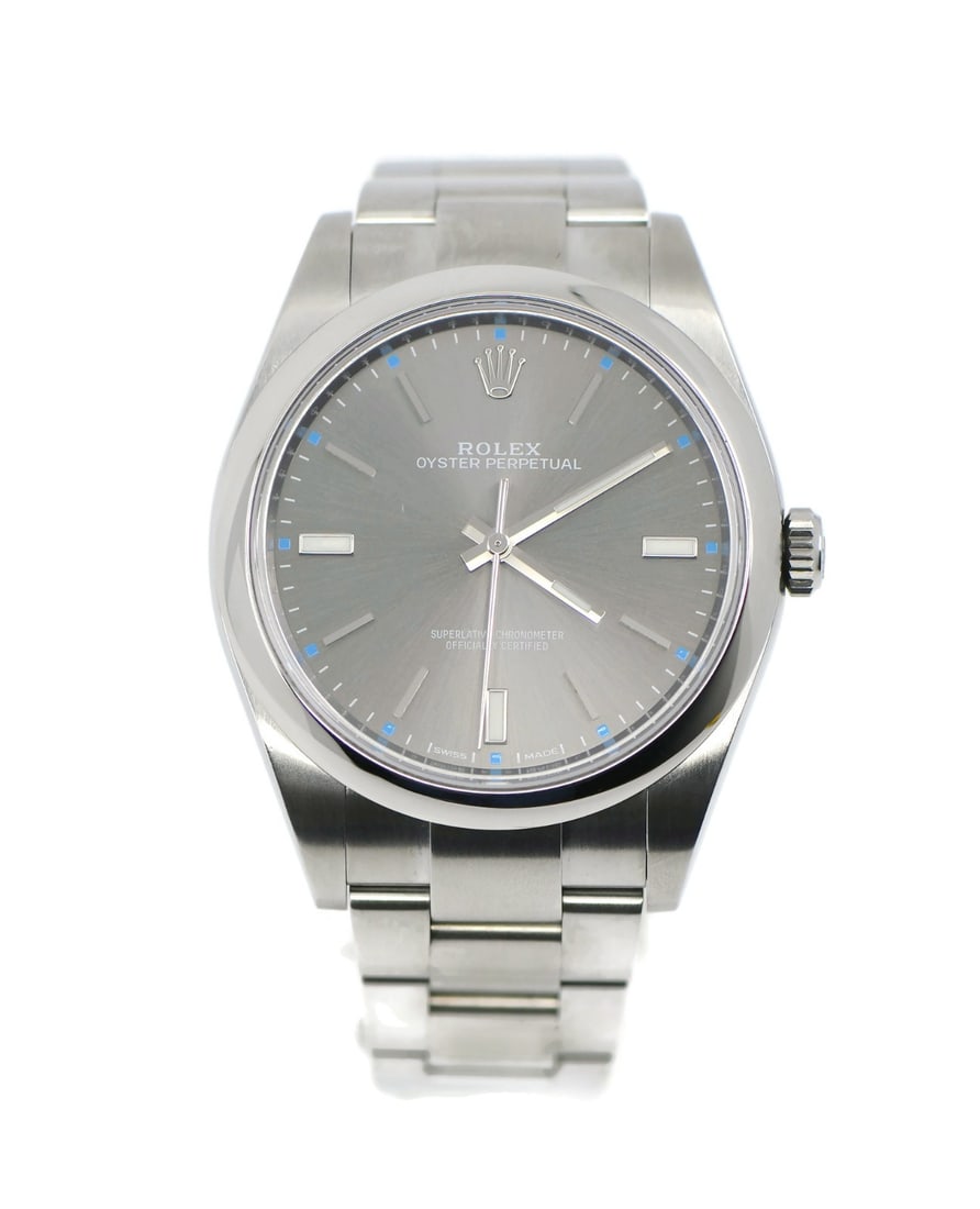Rolex Oyster Perpetual 39mm Stainless Steel Watch 114300 with Box and Papers: Rolex Oyster Perpetual 39mm Stainless Steel Watch 114300 with Box and Papers Presenting the Rolex Oyster Perpetual 39, a stunning wristwatch crafted from stainless steel. This model features a mechani