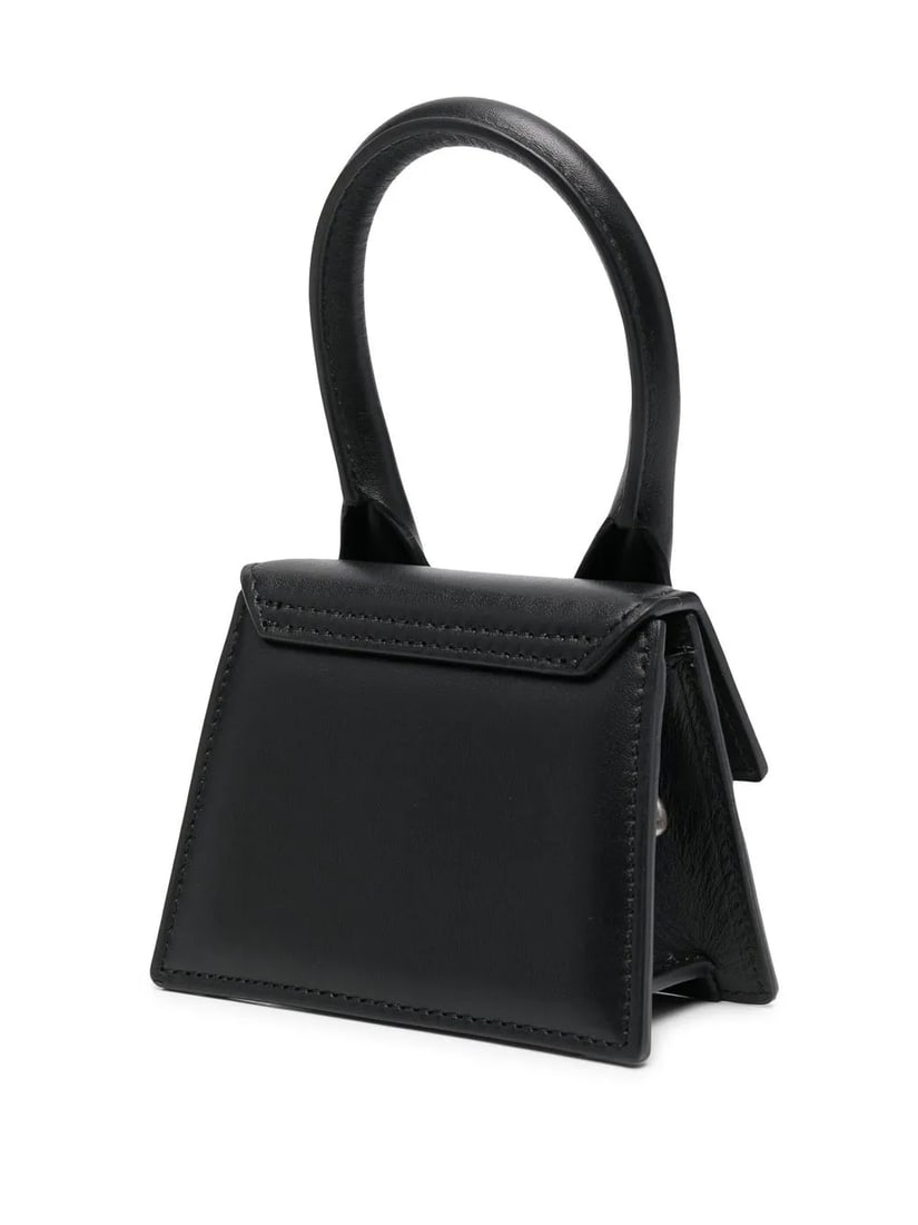 Jacquemus Le Chiquito Mini Black Leather Bag for Men: Jacquemus Le Chiquito Mini Black Leather Bag for Men The Jacquemus Le Chiquito Mini is a compact leather bag in black, designed for men. Crafted in Italy, it features a sleek silhouette and is present