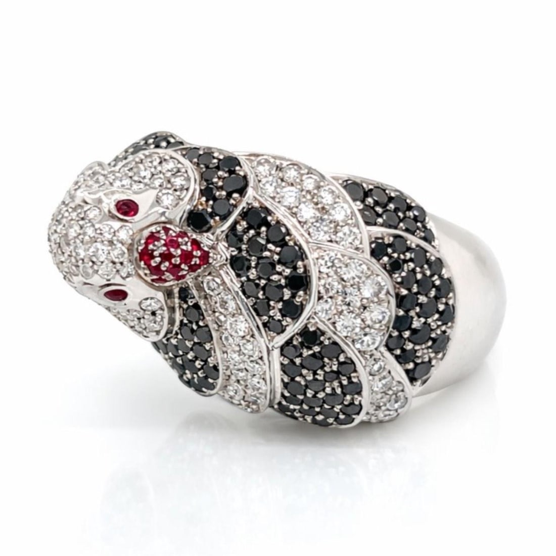 18K White Gold Ring with Diamonds Rubies and Pigeon Motif by Hans D. Krieger: 18K White Gold Ring with Diamonds Rubies and Pigeon Motif by Hans D. Krieger This HANS D. KRIEGER ring is crafted in 18K white gold and features a pigeon motif adorned with 1.54 carats of F-G color, V
