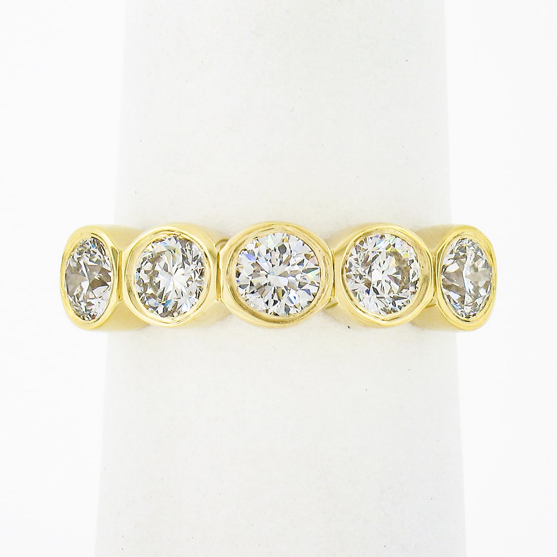 Custom 18K Yellow Gold 1.21ctw Bezel Set 5 Stone Diamond Wedding Band: Custom 18K Yellow Gold 1.21ctw Bezel Set 5 Stone Diamond Wedding Band This exquisite wedding band ring is crafted from solid 18K yellow gold and showcases five stunning round brilliant cut diamonds, p