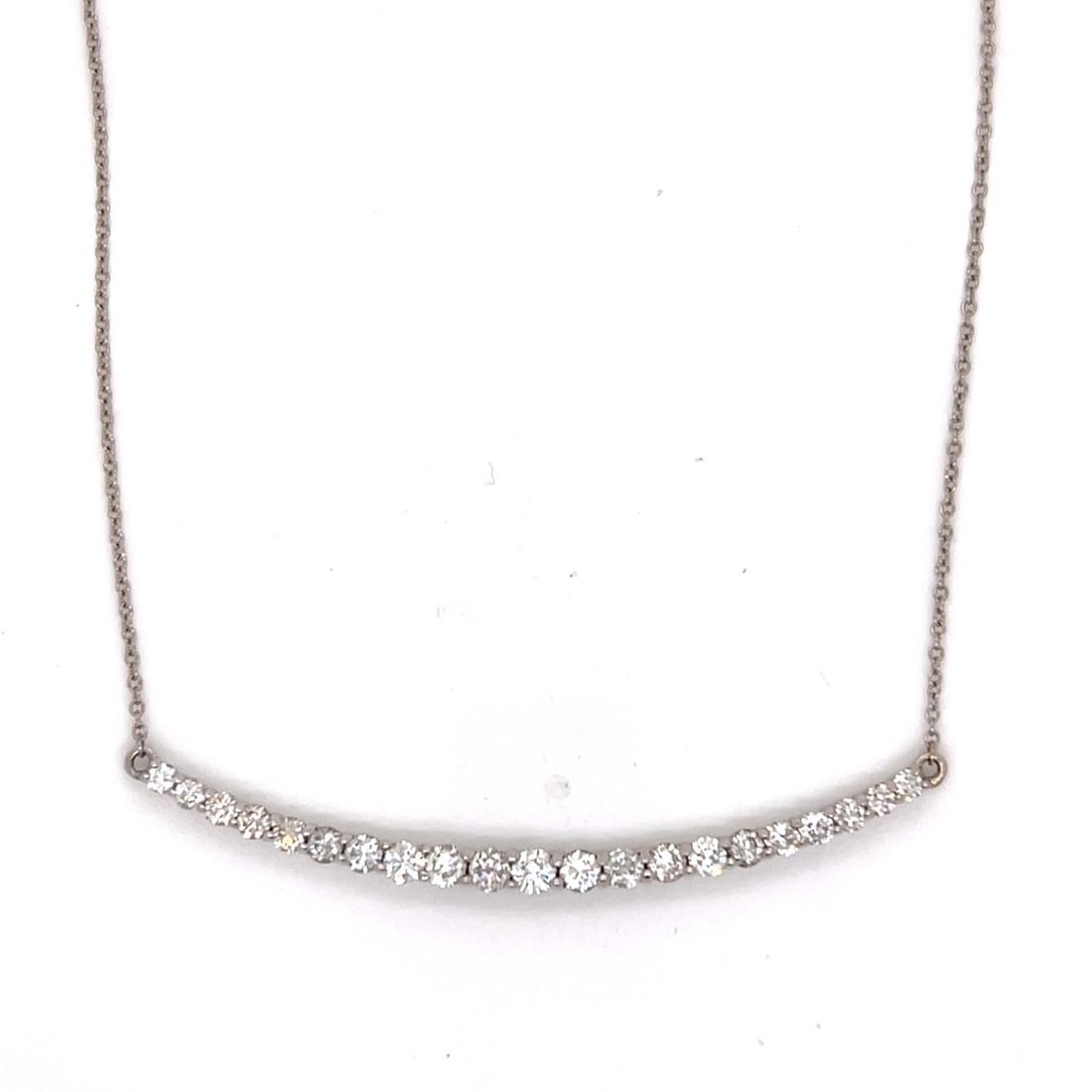 Diamond Necklace in 18K White Gold with 1.35 Carat Total Weight: Diamond Necklace in 18K White Gold with 1.35 Carat Total Weight This pre-owned necklace is crafted from 18K white gold and features 21 diamonds totaling approximately 1.35 carats. The diamonds are H-J