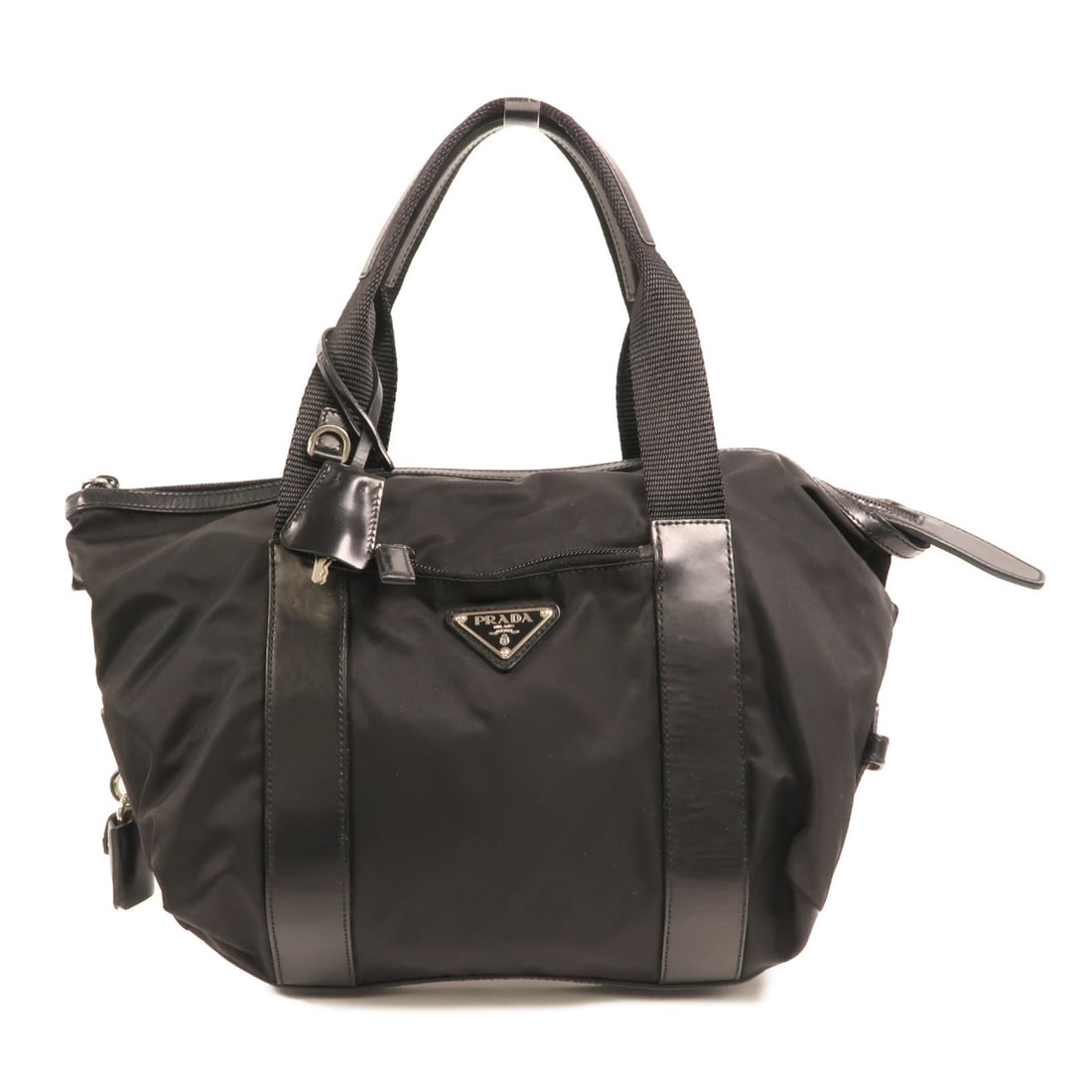 Prada Black Nylon Handbag with Silver Tone Hardware: Prada Black Nylon Handbag with Silver Tone Hardware This Prada handbag features a sleek black nylon exterior and is designed for women. Crafted in Italy, it offers a regular size with a minimalist sil
