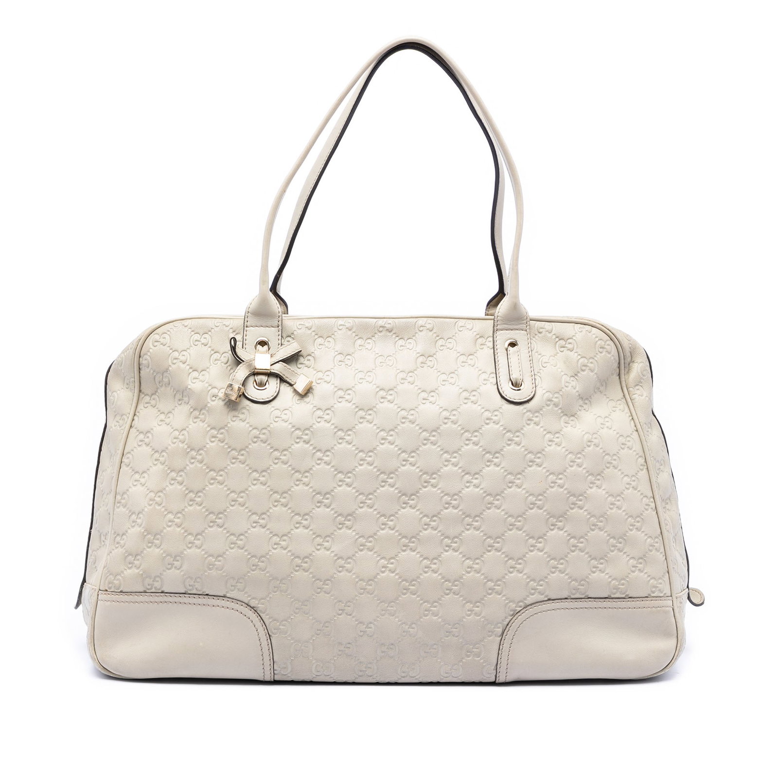 Gucci Princy White Leather Tote Bag with Guccissima Pattern: Gucci Princy White Leather Tote Bag with Guccissima Pattern This Princy tote bag features a leather body with rolled leather handles, a top zip closure, and interior zip and slip pockets. The bag is c