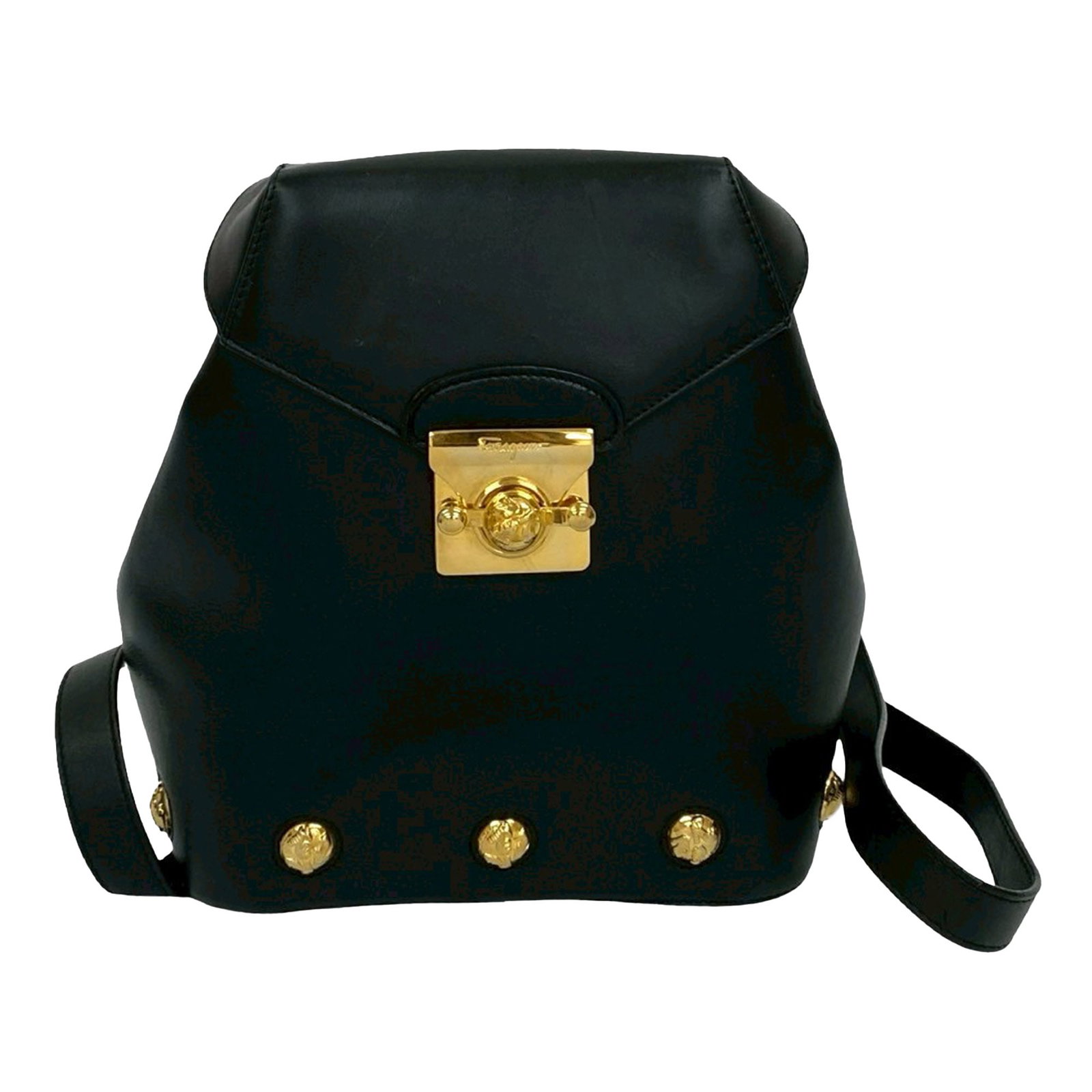 Gancini Black Leather Backpack by Ferragamo: Gancini Black Leather Backpack by Ferragamo This Ferragamo Gancini backpack features a black calfskin leather body, a flat leather strap, a front flap with a flip lock closure, and an interior zip poc