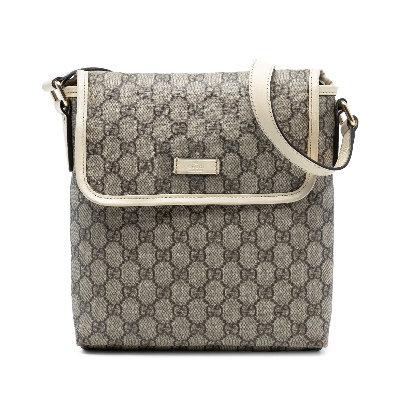 GG Supreme Brown Coated Canvas Crossbody Bag with Leather Trim by Gucci: GG Supreme Brown Coated Canvas Crossbody Bag with Leather Trim by Gucci This Gucci GG Supreme Crossbody bag features a coated canvas body with leather trim, a flat adjustable strap, a top flap with a 