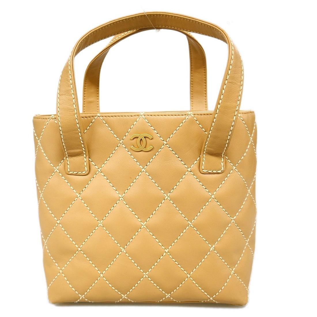 Chanel Wild Stitch Beige Calfskin Quilted Medium Top Handle Bag: Chanel Wild Stitch Beige Calfskin Quilted Medium Top Handle Bag This Chanel Wild Stitch handbag features beige quilted calfskin leather with a top handle design. The bag is medium-sized and includes b