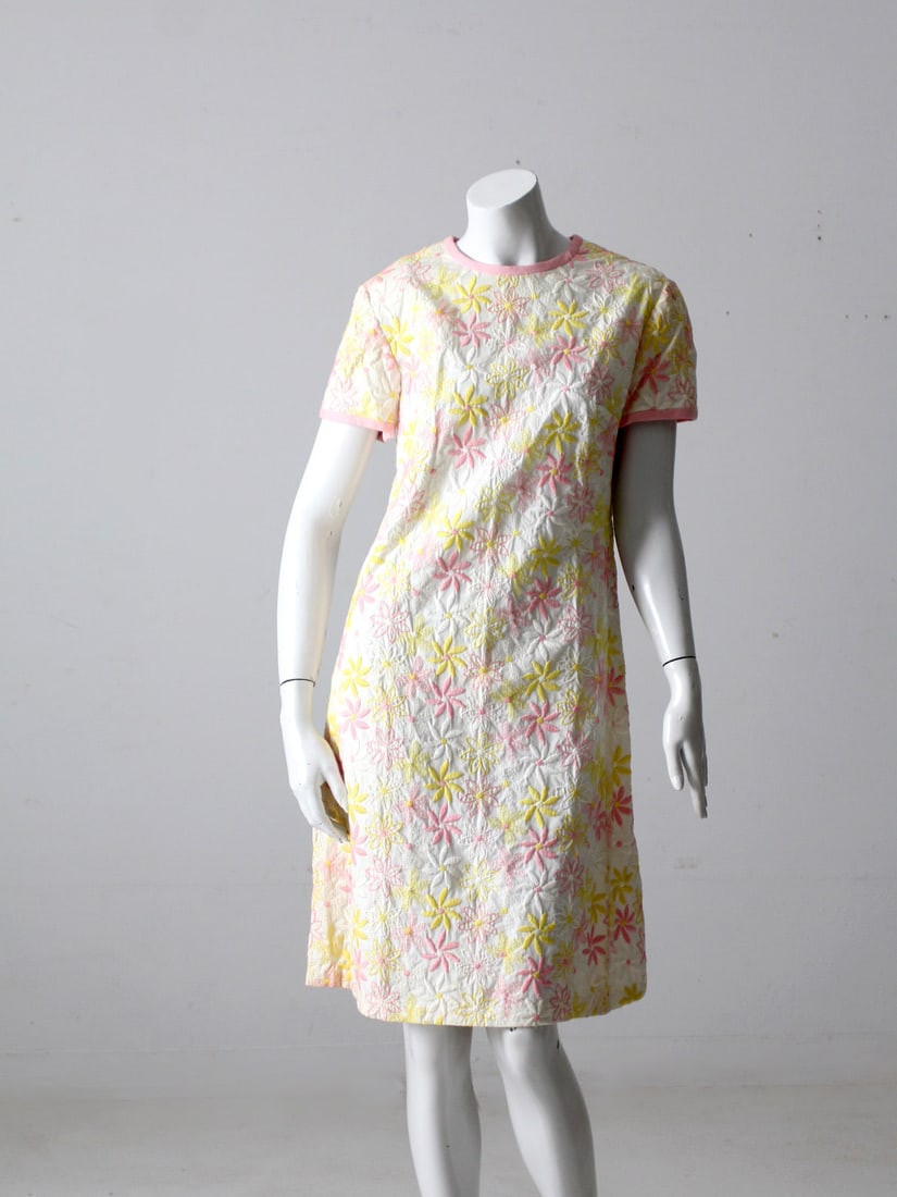 1960s L'Aiglon Floral Dress in Pink White Yellow: 1960s L'Aiglon Floral Dress in Pink White Yellow This stunning 1960s vintage dress by L'Aiglon features a delightful floral pattern in shades of pink, white, and yellow. The dress is designed with sho