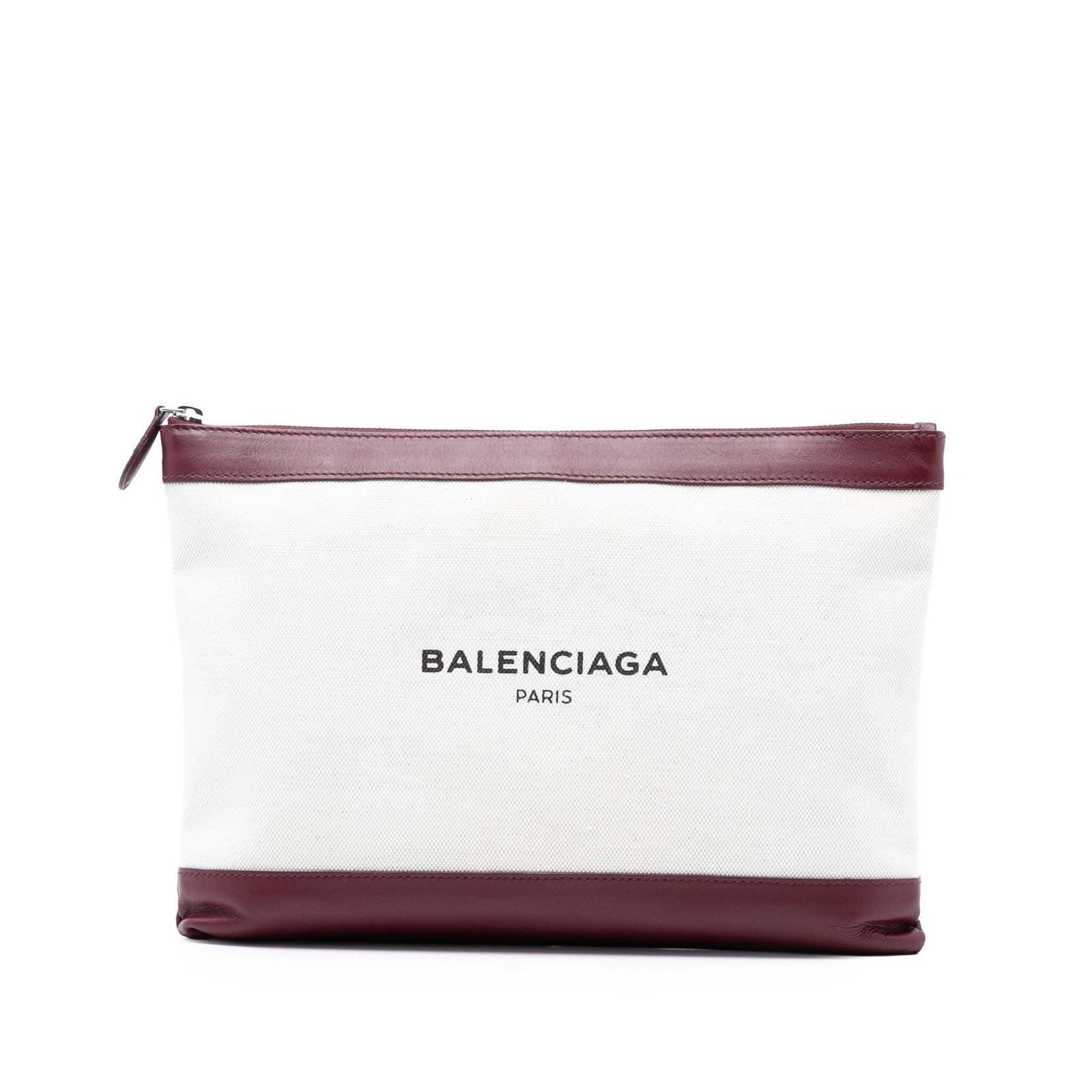 Balenciaga Navy Clip M Canvas Clutch with Leather Trim: Balenciaga Navy Clip M Canvas Clutch with Leather Trim This Balenciaga M Canvas Navy Clip Clutch features a canvas body with leather trim, a top zip closure, and an interior slip pocket. The clutch is