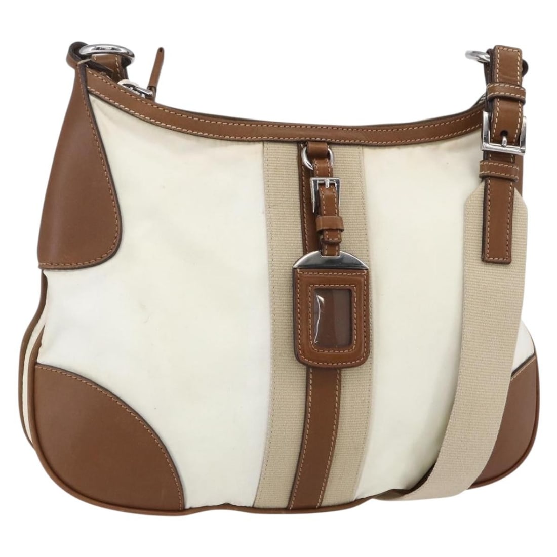 Beige Nylon and Leather Prada Vintage Shoulder Bag Italy: Beige Nylon and Leather Prada Vintage Shoulder Bag Italy This Prada vintage shoulder bag is crafted from beige nylon with leather accents. Designed for women, it offers a classic and functional style.