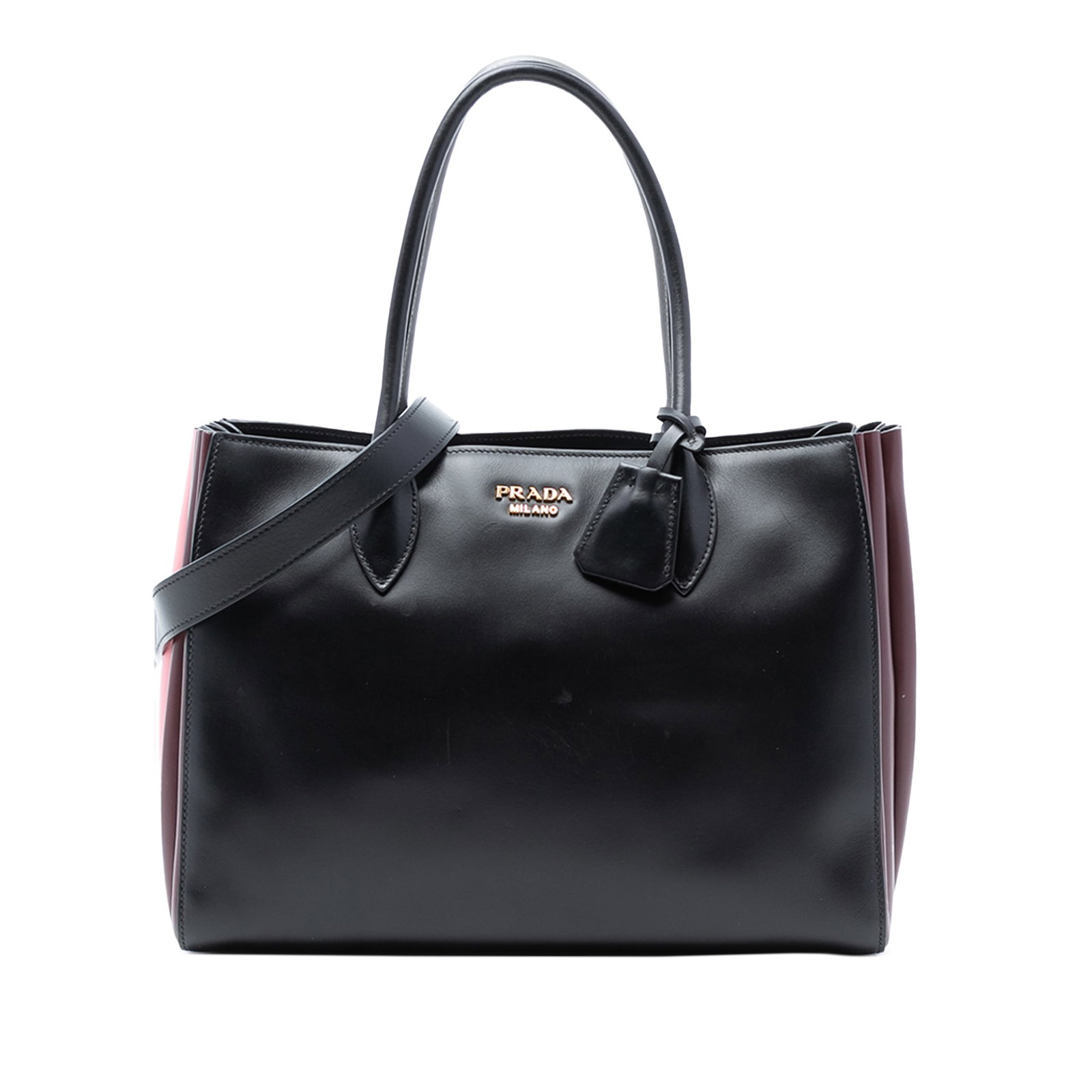 Prada City Calf Leather Bibliotheque Black Satchel with Gold Tone Hardware: Prada City Calf Leather Bibliotheque Black Satchel with Gold Tone Hardware The Prada City Calf Bibliotheque Satchel is crafted from black leather and features gold-tone hardware, rolled leather handle