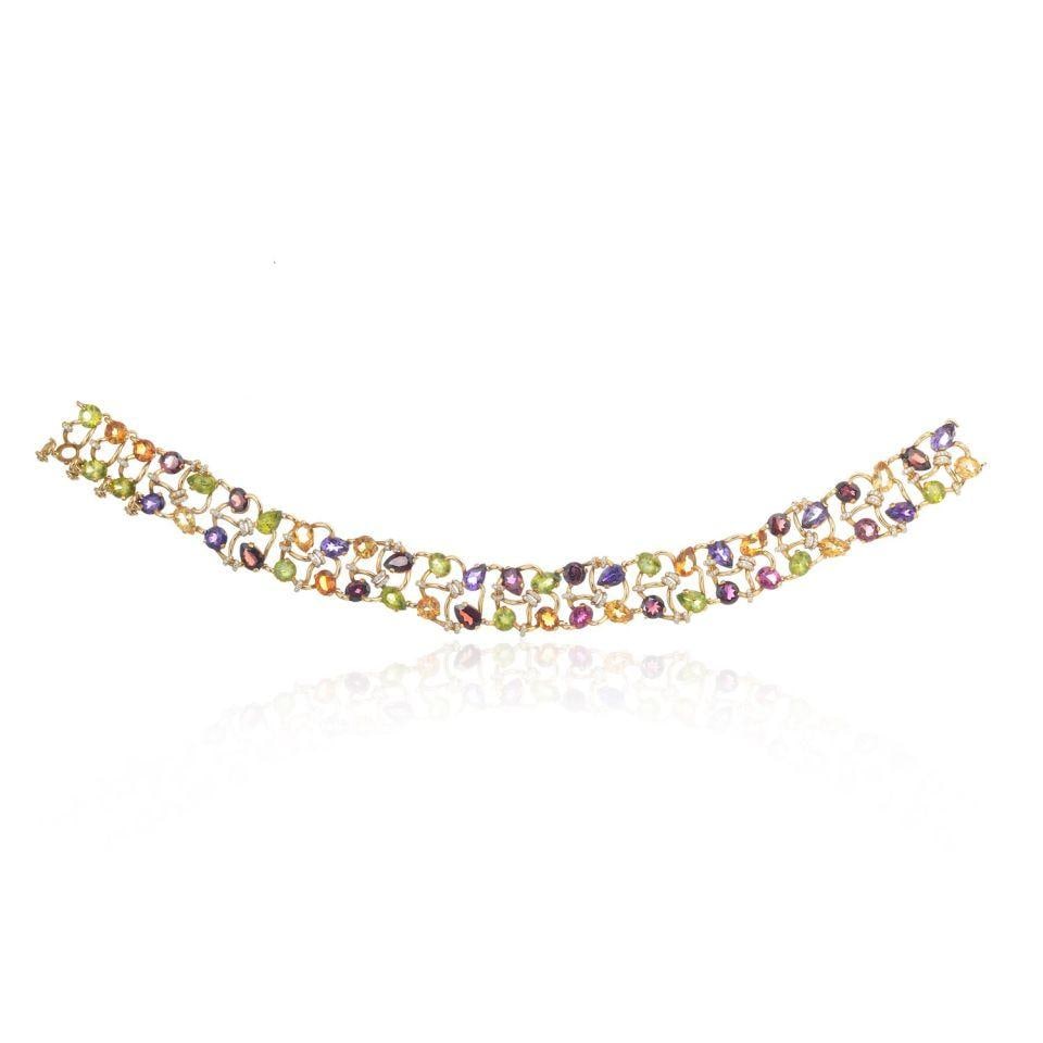 Chanel 18K Yellow Gold Multicolor Gemstone Diamond Collar Necklace: Chanel 18K Yellow Gold Multicolor Gemstone Diamond Collar Necklace This exquisite collar necklace showcases a stunning array of multicolor gemstones beautifully set in luxurious 18K yellow gold. Weigh