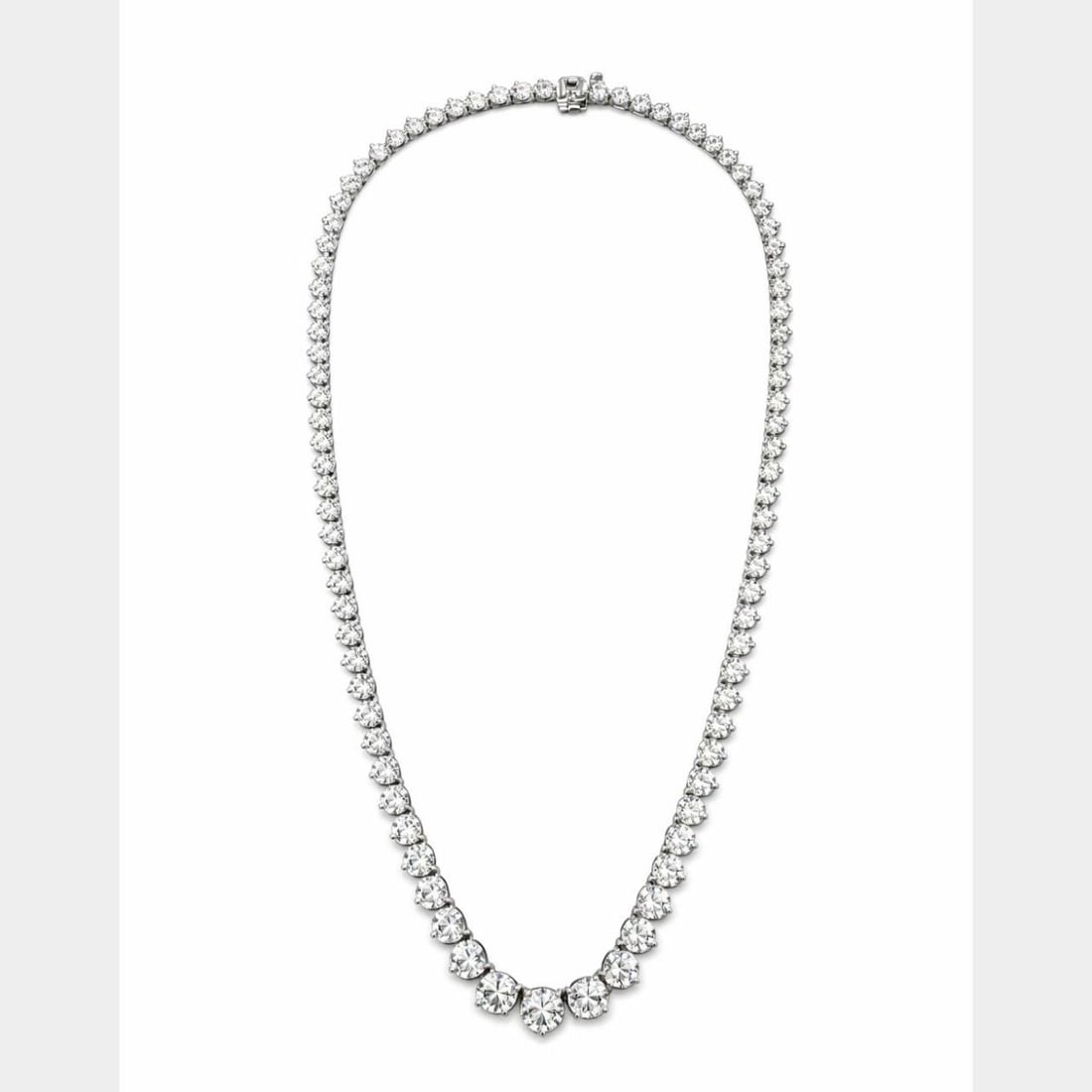 28.05 Carat Diamond Tennis Necklace in 14K White Gold 17 Inch: 28.05 Carat Diamond Tennis Necklace in 14K White Gold 17 Inch This 14K white gold graduated diamond tennis necklace features a total diamond weight of 28.05 carats. The necklace is set with a 2.05 car