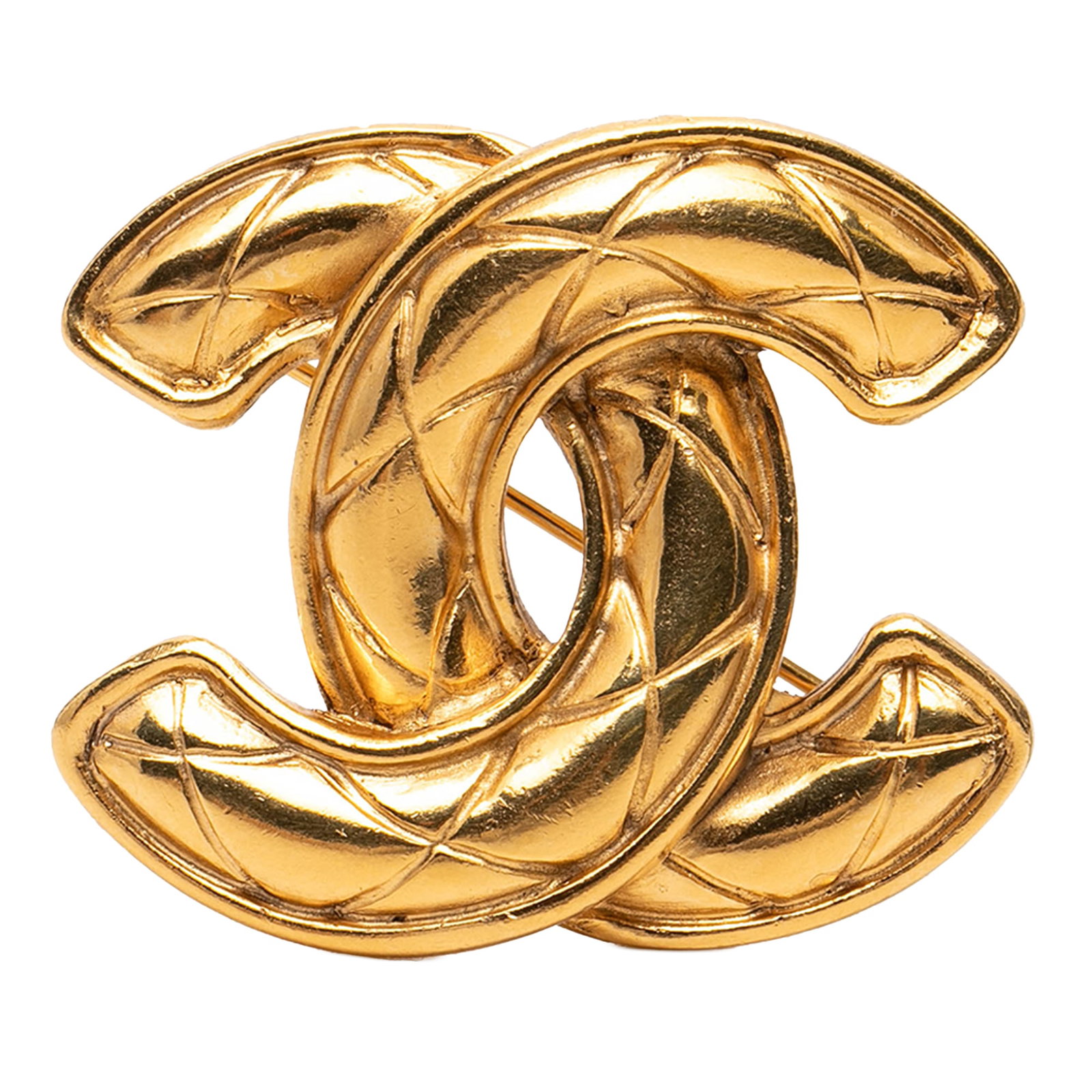 Chanel Quilted CC Brooch in Gold Tone Metal: Chanel Quilted CC Brooch in Gold Tone Metal This Chanel Gold Plated CC Quilted Brooch showcases the brand's signature quilted CC design in a gold-tone metal finish. The brooch is designed with a back 