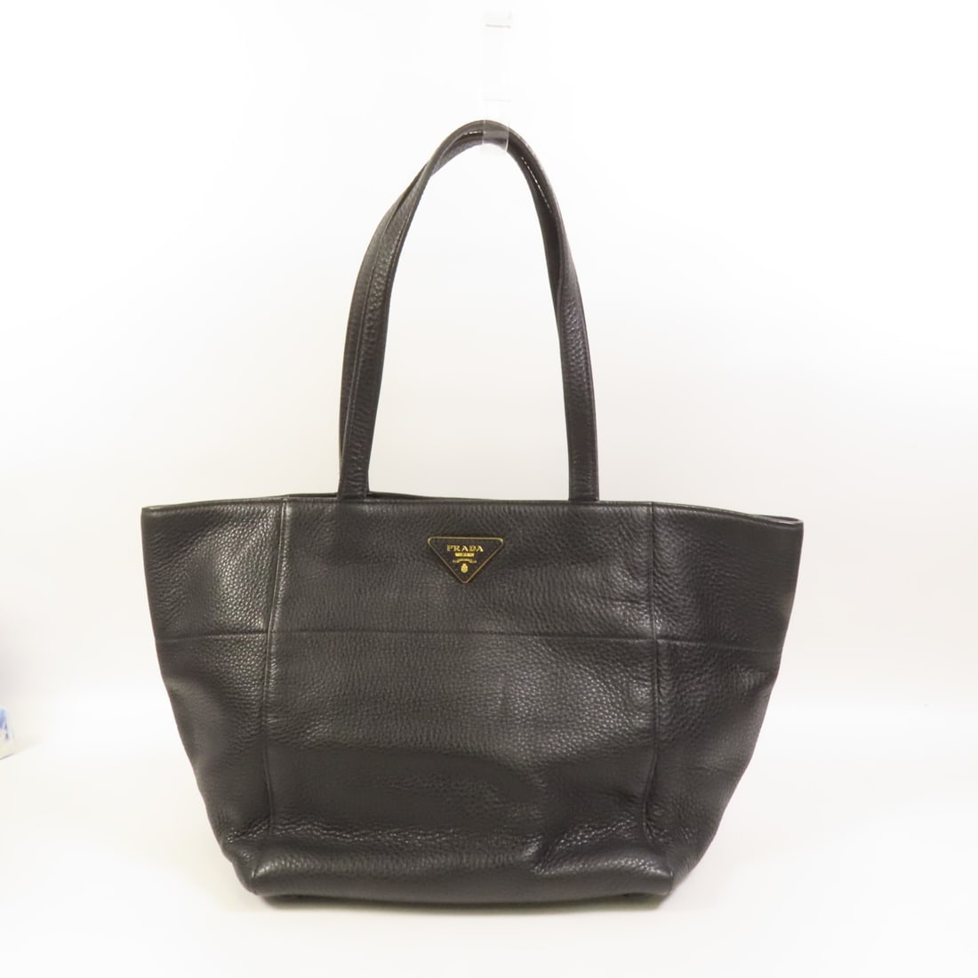 Black Calfskin PRADA Shoulder and Tote Bag from Italy: Black Calfskin PRADA Shoulder and Tote Bag from Italy This Prada tote bag is crafted from black calfskin leather, offering a versatile and stylish accessory suitable for everyday use. Made in Italy, i