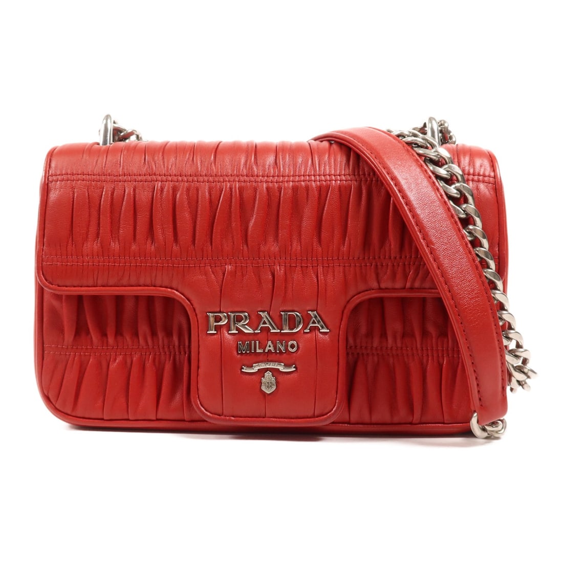 PRADA 1BD140 Chain Shoulder Bag Calfskin Leather Red Italy: PRADA 1BD140 Chain Shoulder Bag Calfskin Leather Red Italy Introducing the PRADA Chain Shoulder Bag, a stylish accessory crafted from high-quality calfskin leather in a vibrant red hue. This shoulder 