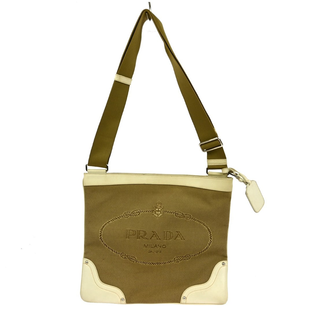 Prada Medium Beige Nylon and Leather Shoulder Bag with Logo Accent: Prada Medium Beige Nylon and Leather Shoulder Bag with Logo Accent This Prada shoulder bag features a beige nylon and leather exterior with brown leather handles, accented by the brand's signature log