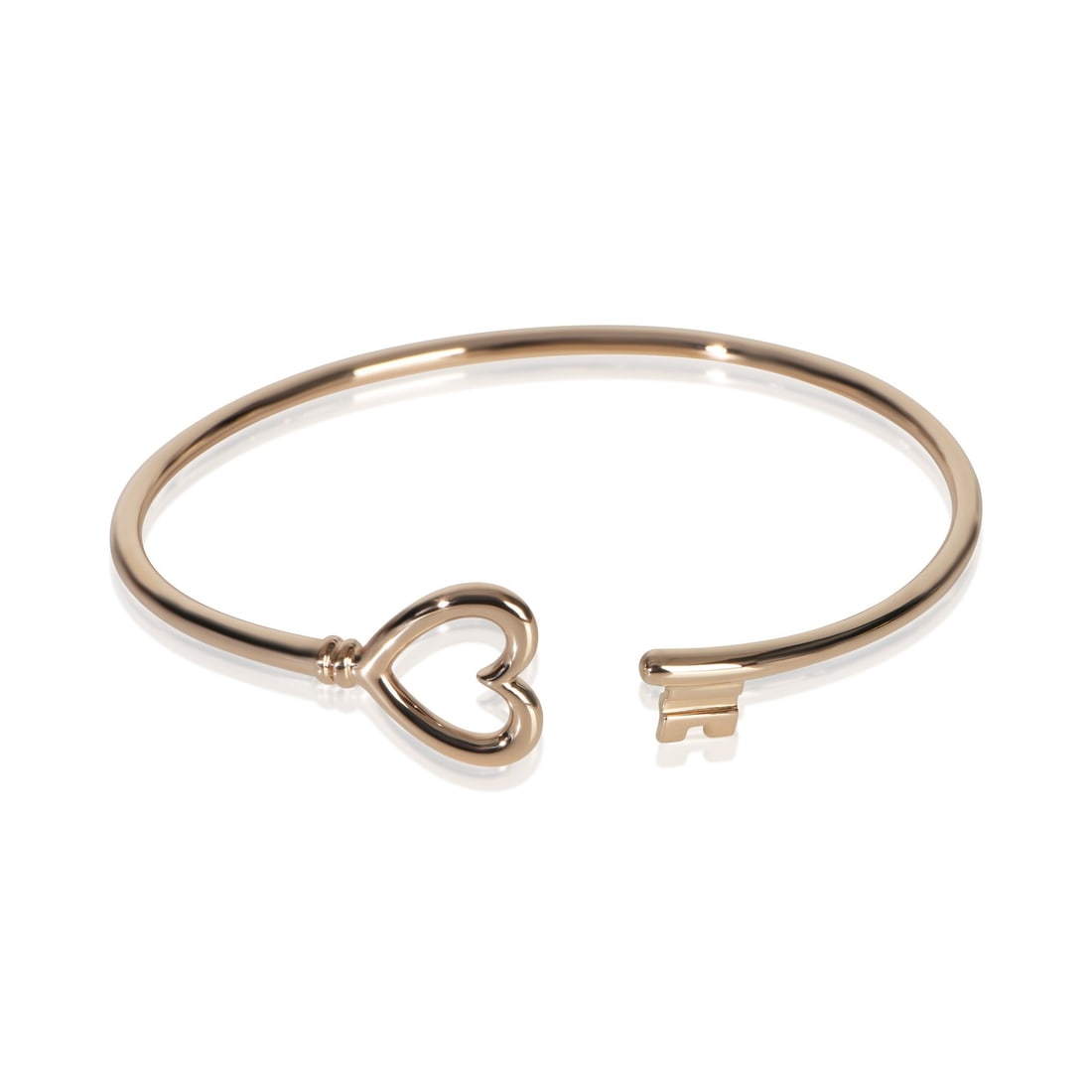 Heart Key Wire Bracelet in 18k Rose Gold with Box by Tiffany & Co.: Heart Key Wire Bracelet in 18k Rose Gold with Box by Tiffany & Co. This Tiffany & Co. Heart Key Wire Bracelet is crafted from 18k rose gold and features a delicate heart key motif. Designed for women,