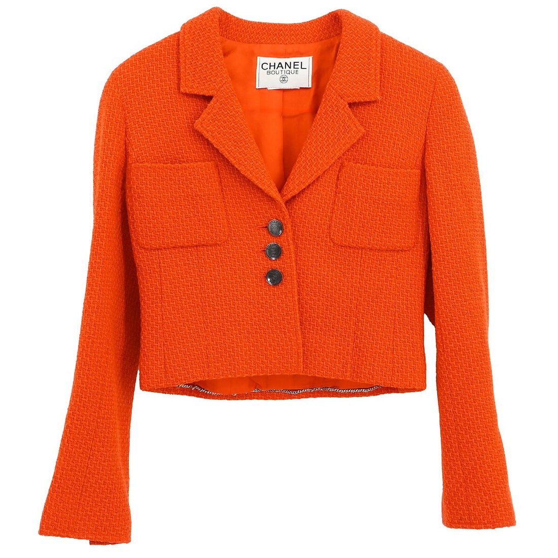 Vintage Chanel Orange Single Breasted Jacket with Logo: Vintage Chanel Orange Single Breasted Jacket with Logo Elevate your wardrobe with this vintage Chanel Single Breasted Jacket in a vibrant orange hue. Crafted from a premium blend of 96% wool and 4% ny