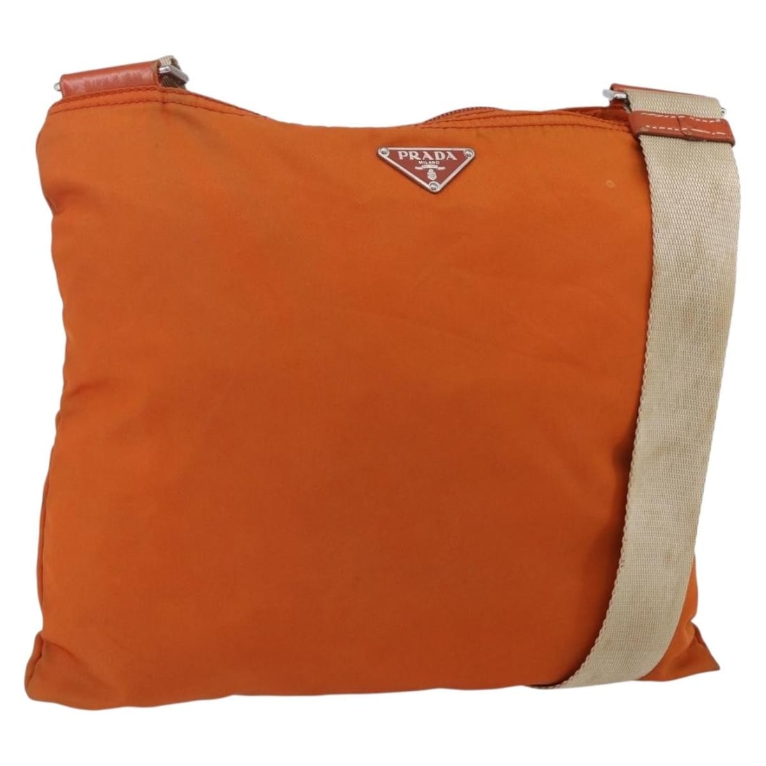 Prada Orange Tessuto Nylon Flat Messenger Crossbody Bag 30cm: Prada Orange Tessuto Nylon Flat Messenger Crossbody Bag 30cm This Prada Flat Messenger Bag is crafted from orange nylon and designed for women. Made in Italy, it features leather and metal fittings. T
