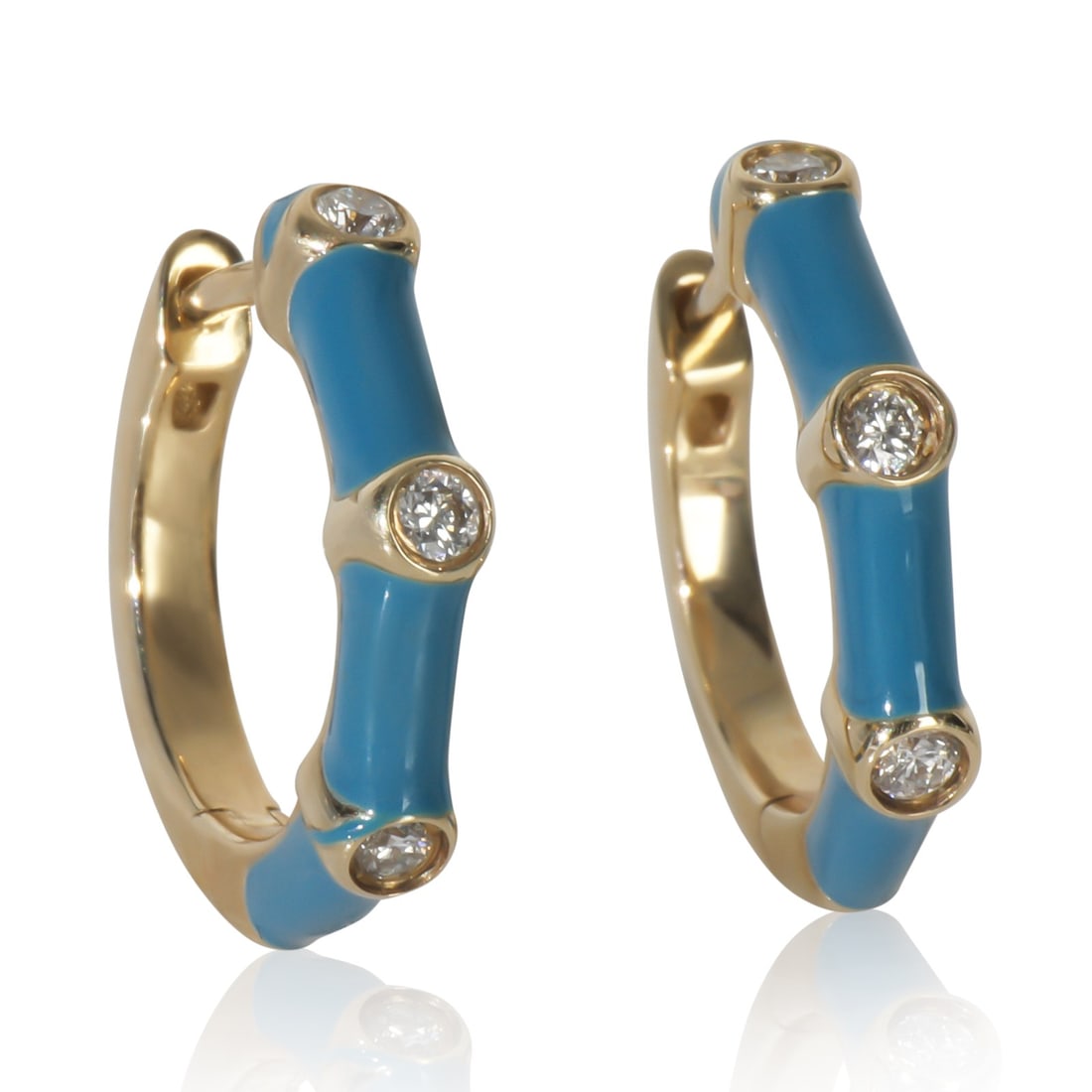 14K Yellow Gold Diamond Huggie Earrings with Blue Enamel: 14K Yellow Gold Diamond Huggie Earrings with Blue Enamel These elegant huggie earrings feature a stunning design crafted from 14K yellow gold, showcasing round brilliant diamonds with a total weight o