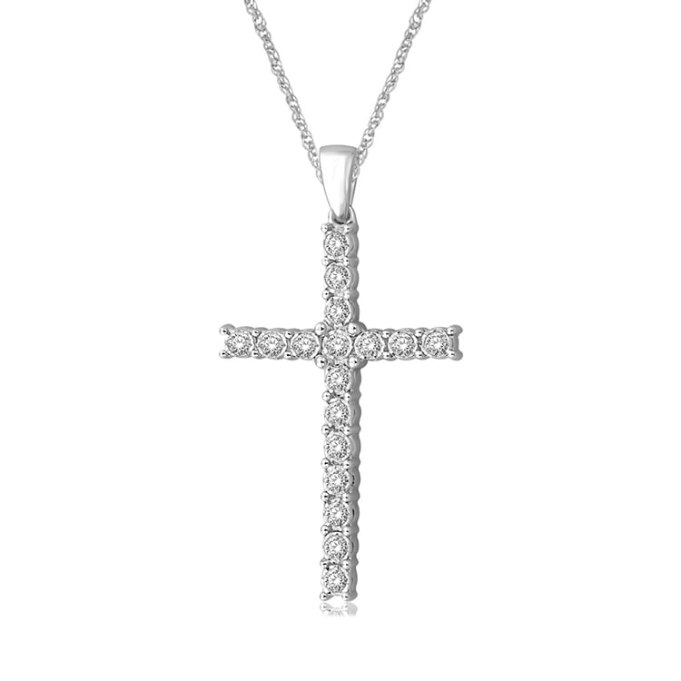 10K White Gold 1/5 Ct.Tw. Diamond Cross Pendant: 10K White Gold 1/5 Ct.Tw. Diamond Cross Pendant As dazzling and brilliant as your faith, this sleek and simple cross is fashioned of 10K white gold and prong-set with sparkling round diamond accents
