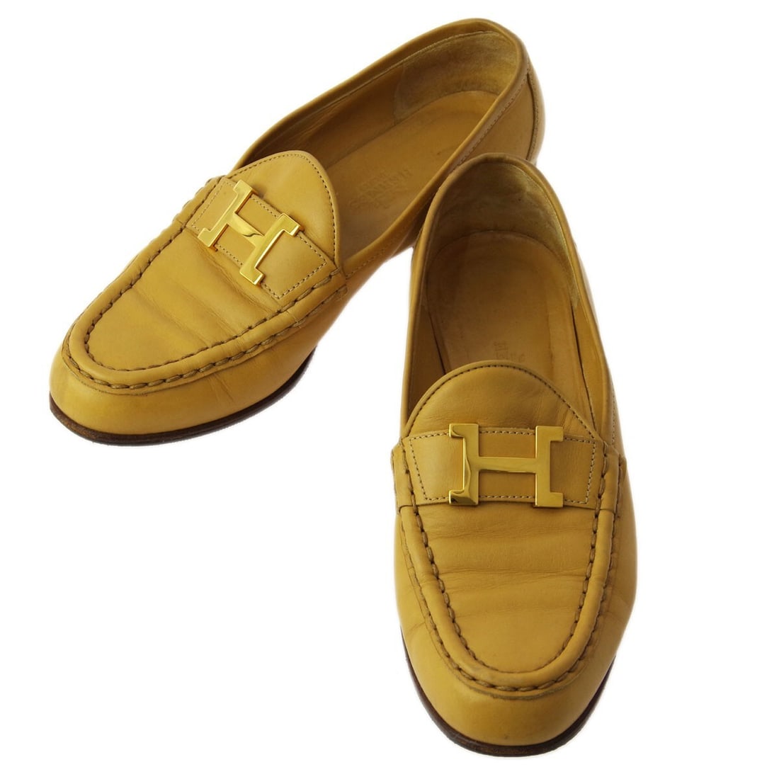 Beige Leather Constance Loafers by Hermes Size 36.5: Beige Leather Constance Loafers by Hermes Size 36.5 Hermes Constance loafers in beige feature a closed toe design and are crafted in Italy with a leather upper and leather lining. These flat loafers a