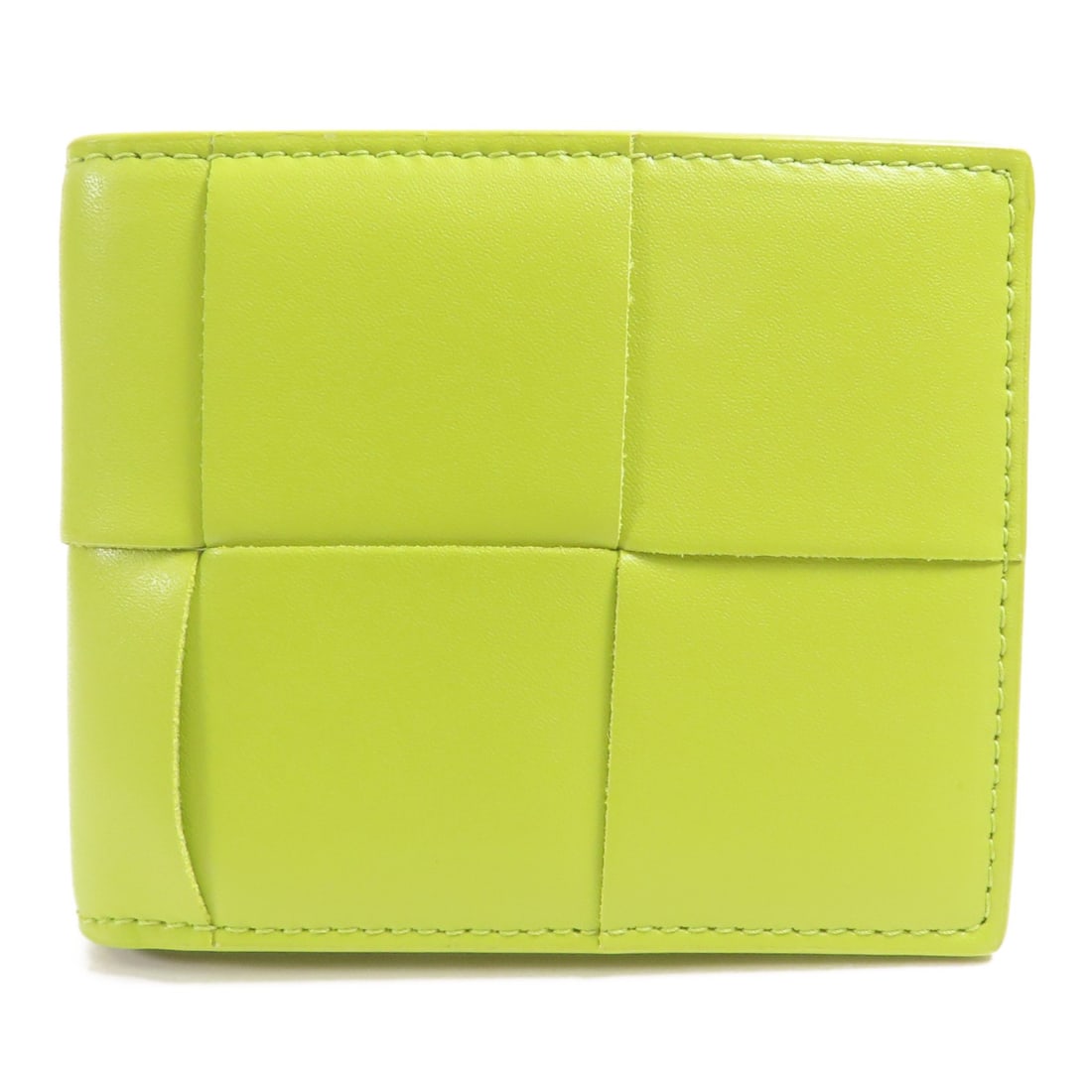 Bottega Veneta Green Lambskin Leather Bi-Fold Wallet Made in Italy: Bottega Veneta Green Lambskin Leather Bi-Fold Wallet Made in Italy This Bottega Veneta bi-fold wallet is crafted from luxurious lambskin leather in an elegant green hue. Designed for both functionalit
