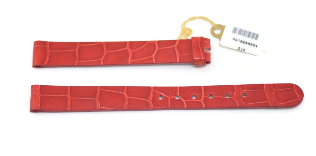 Patek Philippe Authentic Red Leather Watch Strap 12mm: Patek Philippe Authentic Red Leather Watch Strap 12mm Enhance your timepiece with this 12mm red leather wristwatch band from Patek Philippe. Crafted from high-quality leather, this strap combines styl