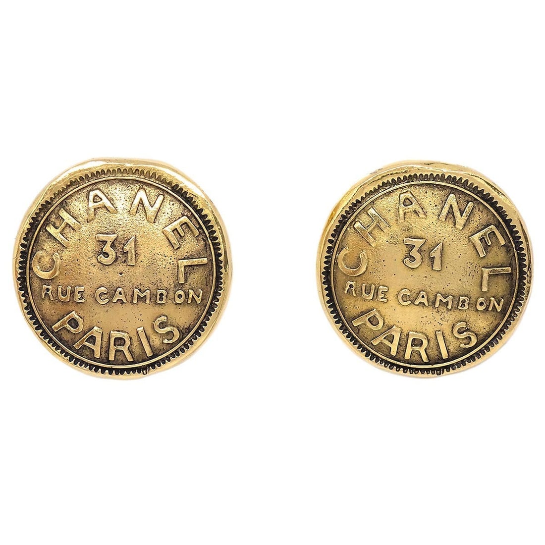 Gold Tone Round Clip-On Button Earrings by Chanel: Gold Tone Round Clip-On Button Earrings by Chanel These Chanel button-style clip-on earrings feature a classic round shape with a gold finish. Made in France, they offer an elegant and timeless access