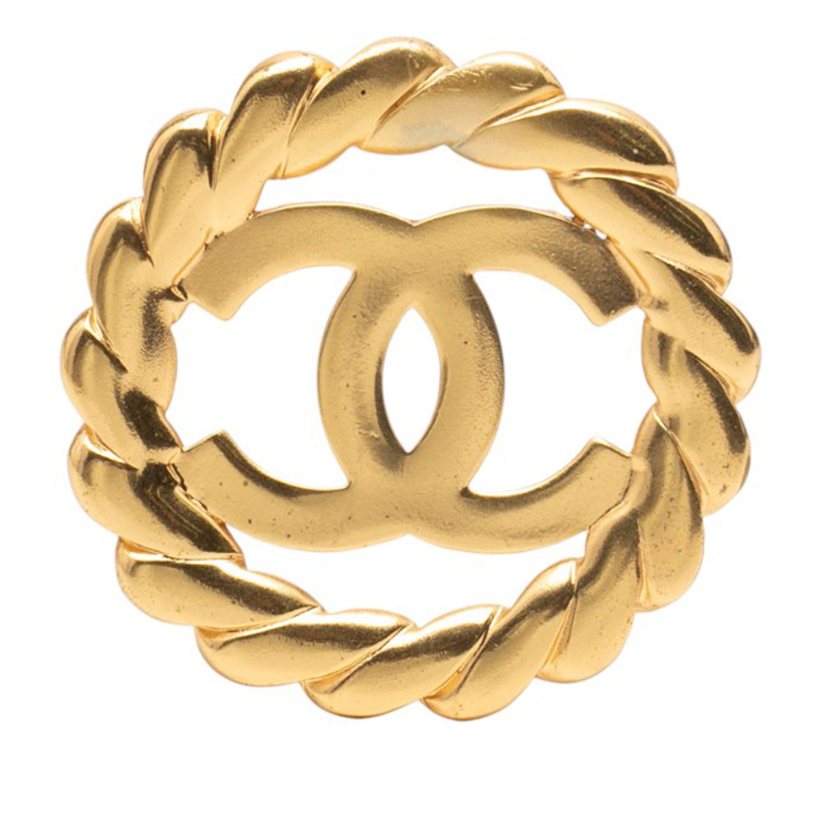 Chanel CC Round Brooch Gold Tone Metal Pin: Chanel CC Round Brooch Gold Tone Metal Pin This Chanel CC Gold Plated Round Brooch features a gold-tone metal body with a round design and back pin closure. The brooch shows signs of discoloration and