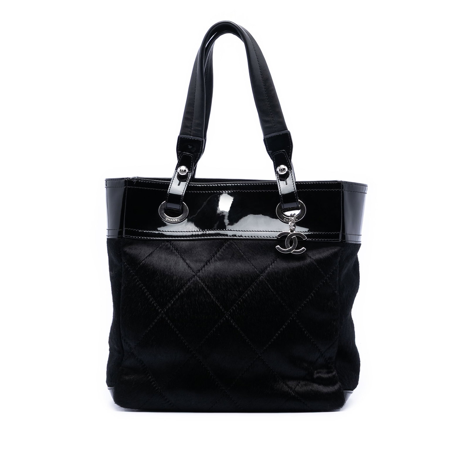 Chanel Paris Biarritz Tote Small Black Pony Hair with Patent Trim: Chanel Paris Biarritz Tote Small Black Pony Hair with Patent Trim This tote bag features a quilted pony hair body accented with patent leather trim, flat handles, a top zip closure, and an interior zi