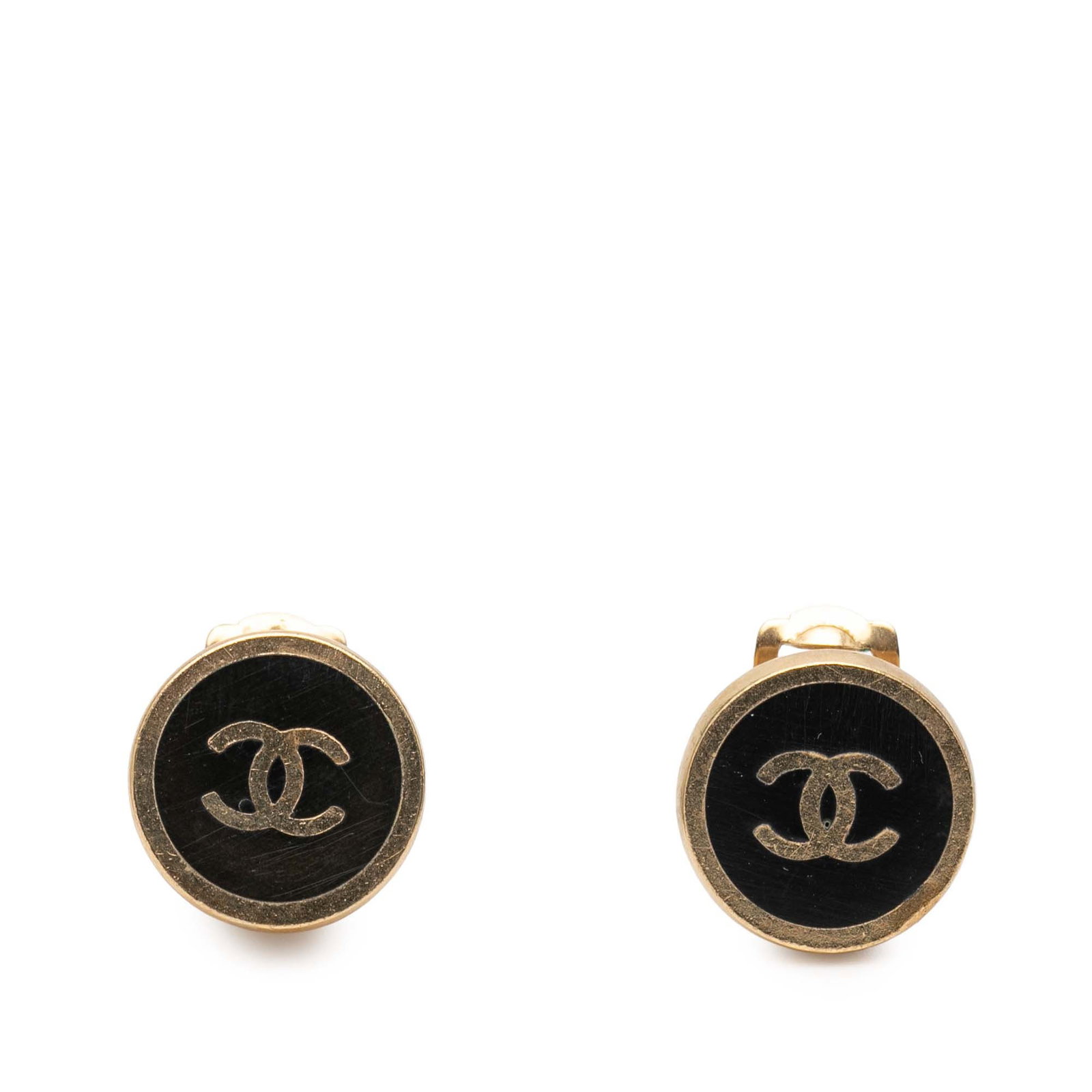 Chanel CC Round Clip Earrings Gold Plated with Black Enamel: Chanel CC Round Clip Earrings Gold Plated with Black Enamel These Chanel clip-on earrings feature a classic round button design crafted from gold-tone metal and enamel. The earrings are designed with 