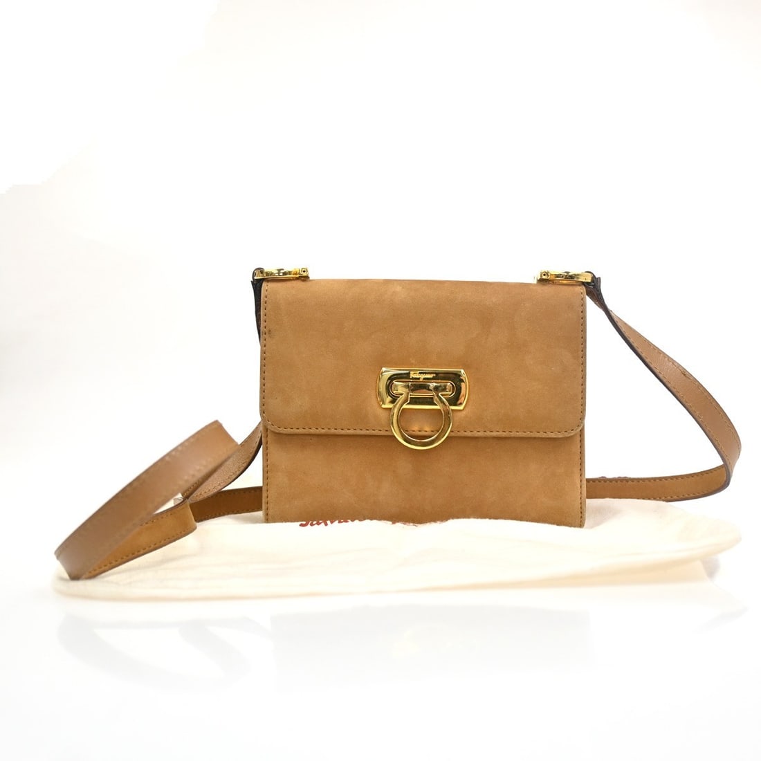 Salvatore Ferragamo Gancini Brown Suede Shoulder Bag: Salvatore Ferragamo Gancini Brown Suede Shoulder Bag This Salvatore Ferragamo Gancini shoulder bag is crafted from brown suede, designed for women. It features a compact size suitable for everyday use