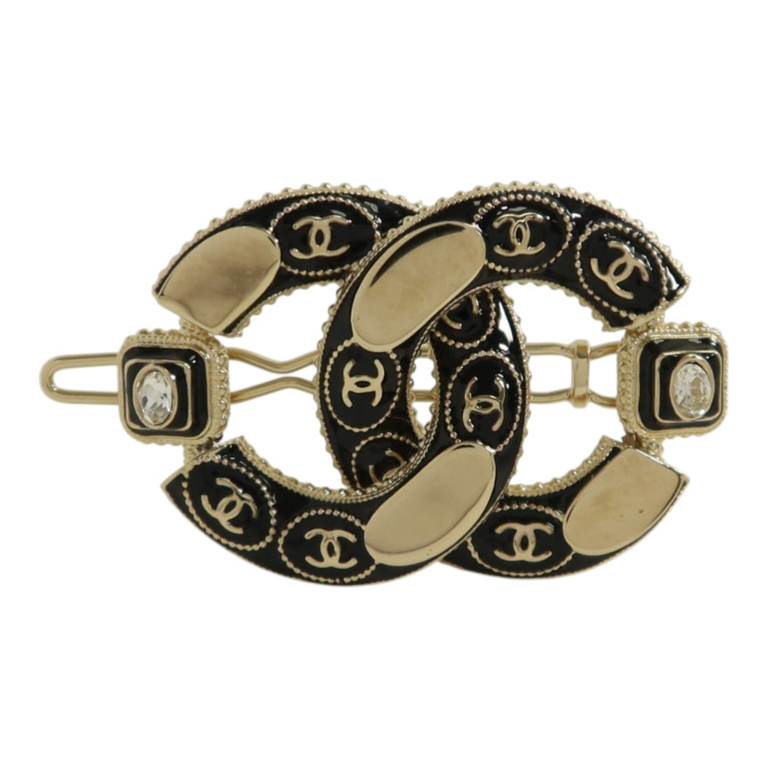 Chanel Valletta Hair Accessory with CC Logo in Gold and Black: Chanel Valletta Hair Accessory with CC Logo in Gold and Black This CHANEL CC hair clip features a black and gold design, crafted for women. The clip is made of metal and other materials, with no main 