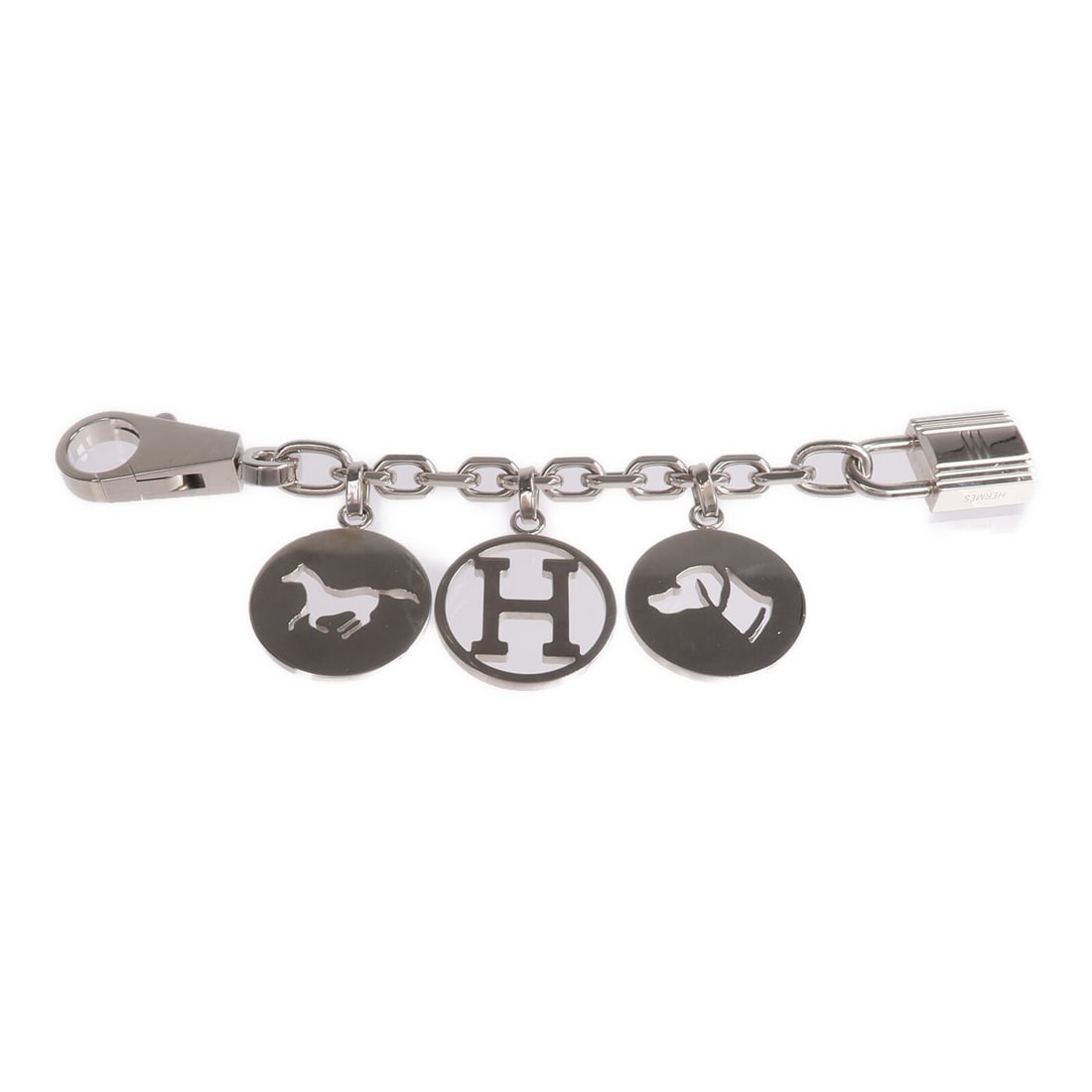 Olga Silver Tone Bag Charm by Hermes: Olga Silver Tone Bag Charm by Hermes This Hermes Breloque Olga bag charm features a silver-tone metal construction, designed for women. Made in France, it is crafted to add a stylish accent to handbag
