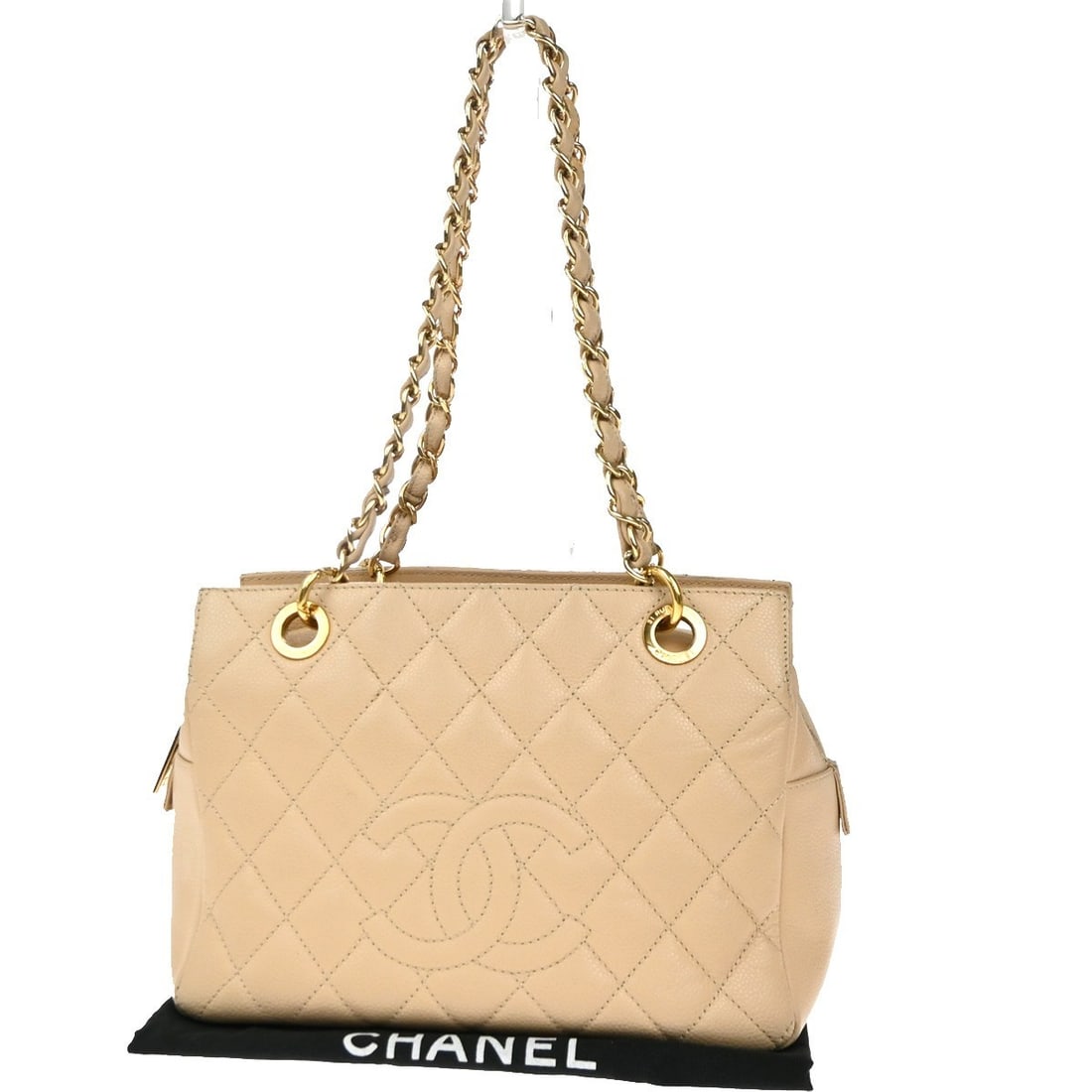 Beige Leather Petite Timeless Tote Bag by Chanel Quilted Caviar: Beige Leather Petite Timeless Tote Bag by Chanel Quilted Caviar The Chanel Petite Timeless Tote features a classic quilted caviar leather design in beige, offering a sophisticated look. This tote is d