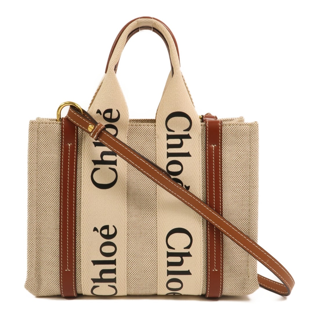 Chloe Woody Small Canvas Shoulder Bag with Gold Tone Hardware White: Chloe Woody Small Canvas Shoulder Bag with Gold Tone Hardware White This Chloe Woody Small 2 Way Shoulder Bag features a white canvas exterior and offers versatile carrying options. Designed for women