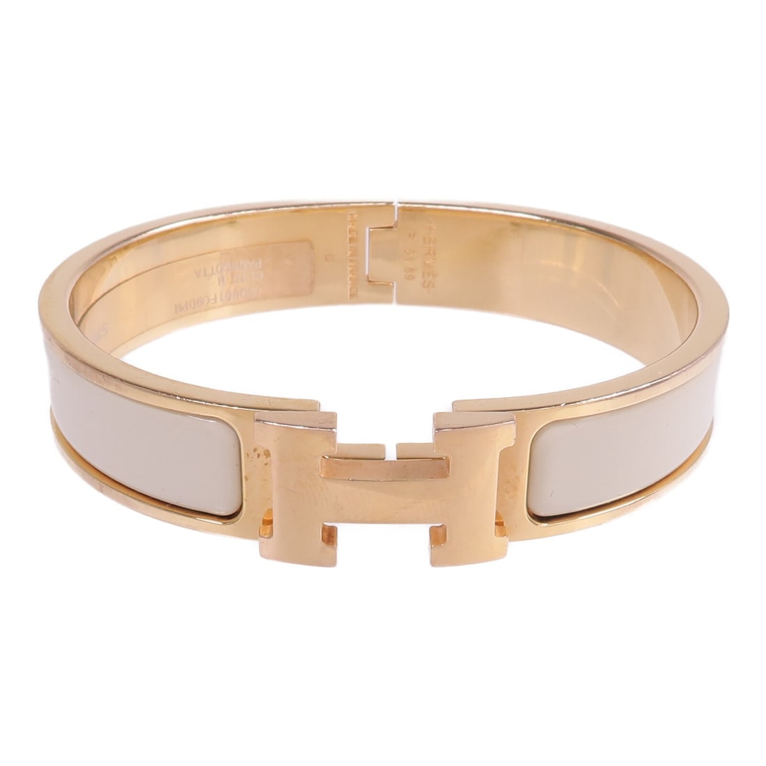 Hermes Clic H White Enamel and Gold Tone Women's Bracelet: Hermes Clic H White Enamel and Gold Tone Women's Bracelet This Hermes Clic H bracelet features a white enamel design with gold-tone metal accents. Designed for women, it offers a classic and elegant l