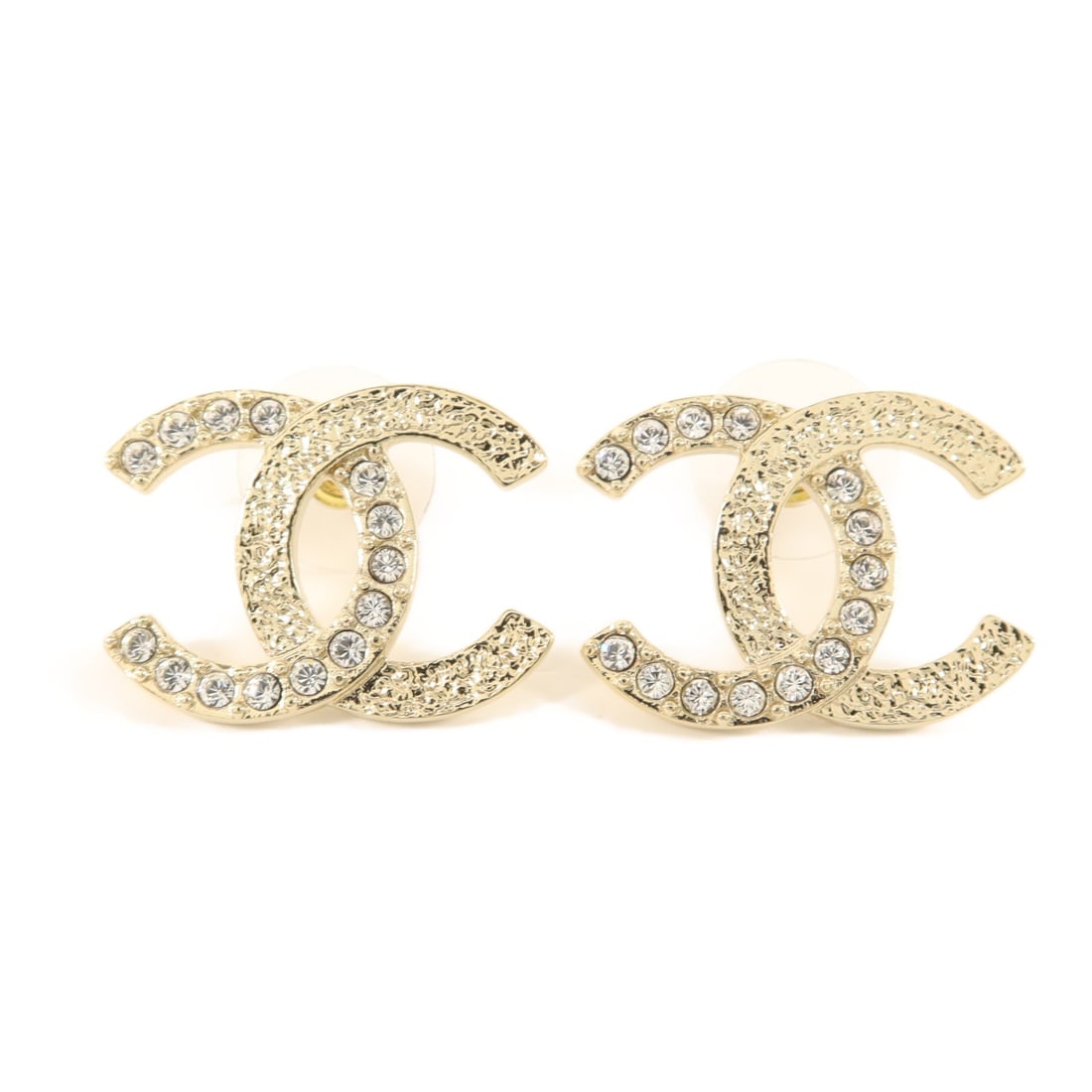 Chanel Gold Tone Crystal CC Logo Pierced Earrings for Women: Chanel Gold Tone Crystal CC Logo Pierced Earrings for Women These CHANEL CC pierced earrings feature a gold-toned design crafted for women. Made in France, they showcase the iconic CC logo and are des