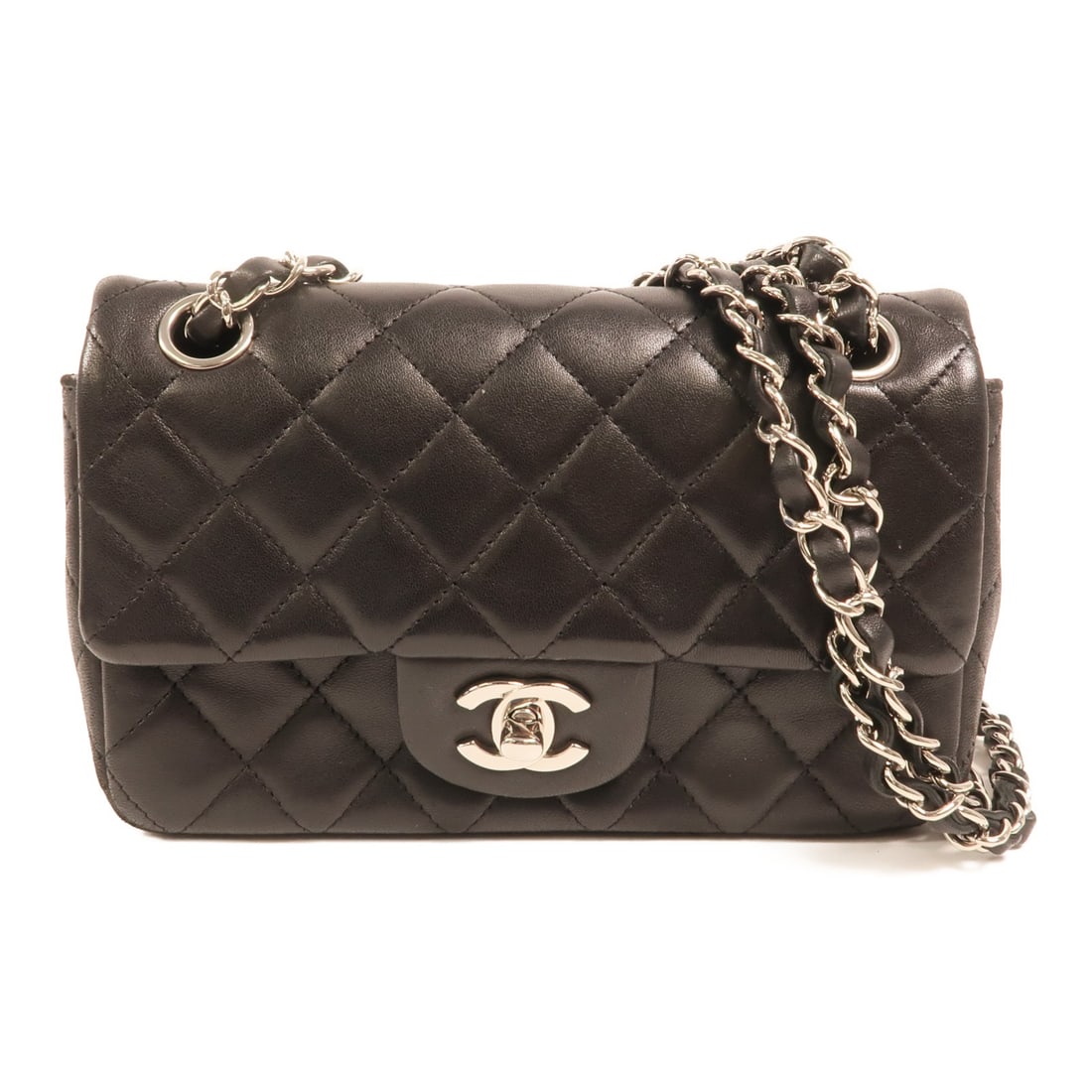 Chanel Mini Classic 20 Black Lambskin Shoulder Bag with Silver Tone Chain: Chanel Mini Classic 20 Black Lambskin Shoulder Bag with Silver Tone Chain This CHANEL Mini Classic 20 chain shoulder bag is crafted from luxurious black lambskin leather. Designed for women, it featur