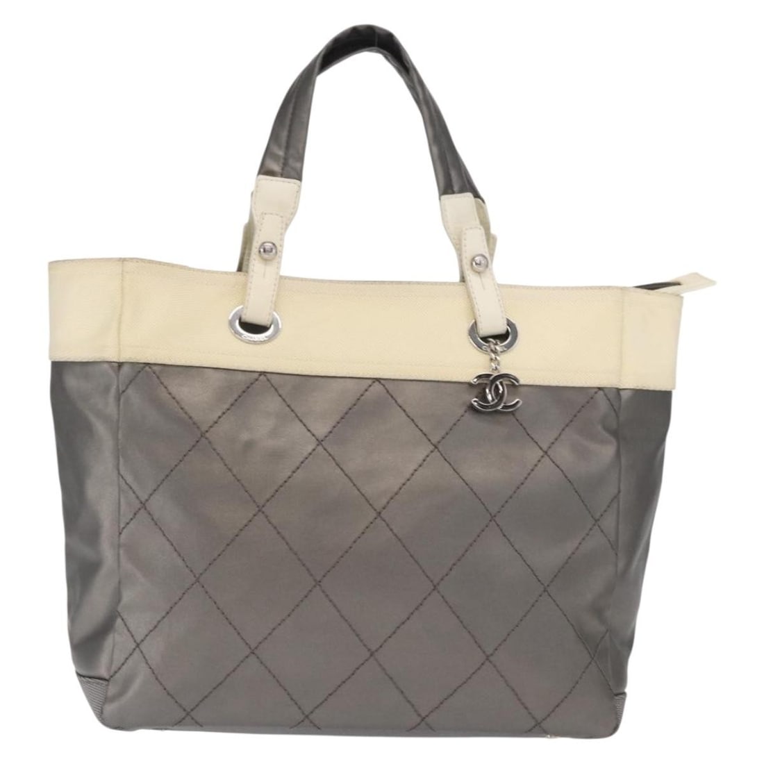 Chanel Nylon Biarritz Tote Silver 34cm by 30cm by 14cm: Chanel Nylon Biarritz Tote Silver 34cm by 30cm by 14cm This Chanel Biarritz Tote for women features a silver nylon exterior with silver-tone metal fittings. The bag shows slight signs of wear, includi