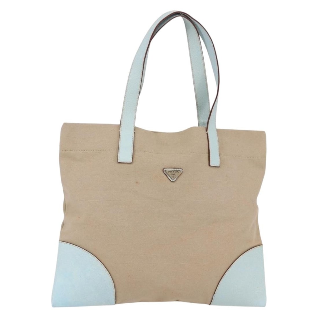 PRADA Canvas Tote Bag Beige Light Blue Made in Italy: PRADA Canvas Tote Bag Beige Light Blue Made in Italy This authentic PRADA Tote Bag combines elegance and functionality with its stylish canvas exterior in a beige and light blue color scheme. Crafted 