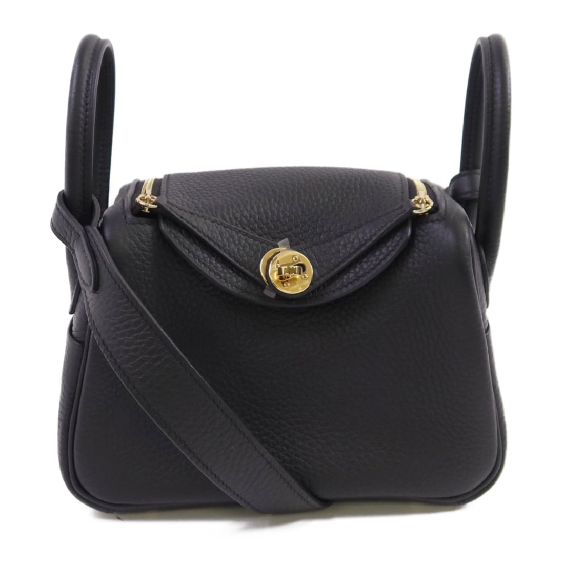Hermes Mini Lindy Black Clemence Leather Crossbody with Gold Hardware: Hermes Mini Lindy Black Clemence Leather Crossbody with Gold Hardware This Hermes Mini Lindy shoulder bag is crafted from Clemence calfskin leather in black, featuring a compact design suitable for bo